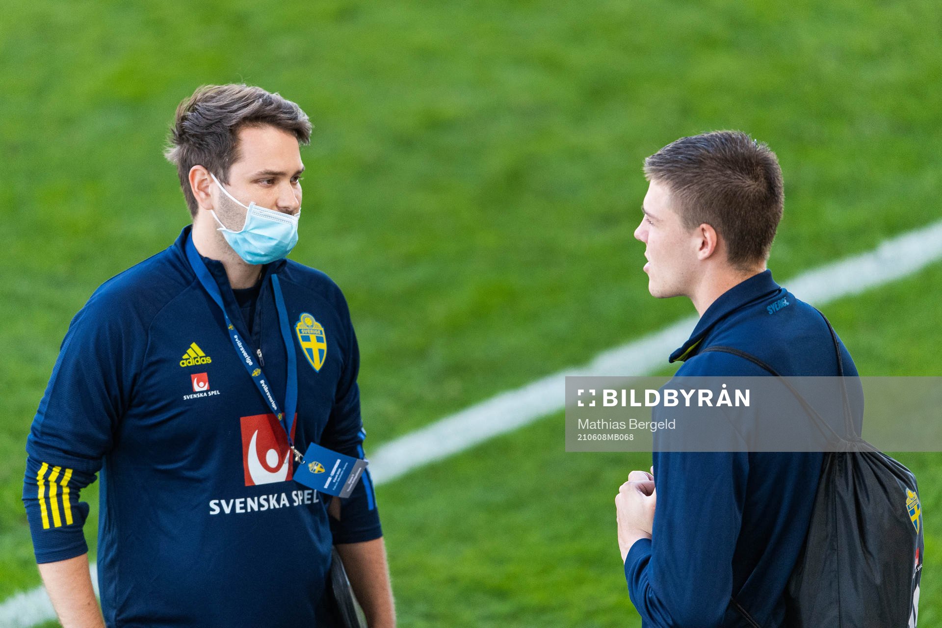 Johan Velagic, media officer, talks to Emil Holm of Sweden