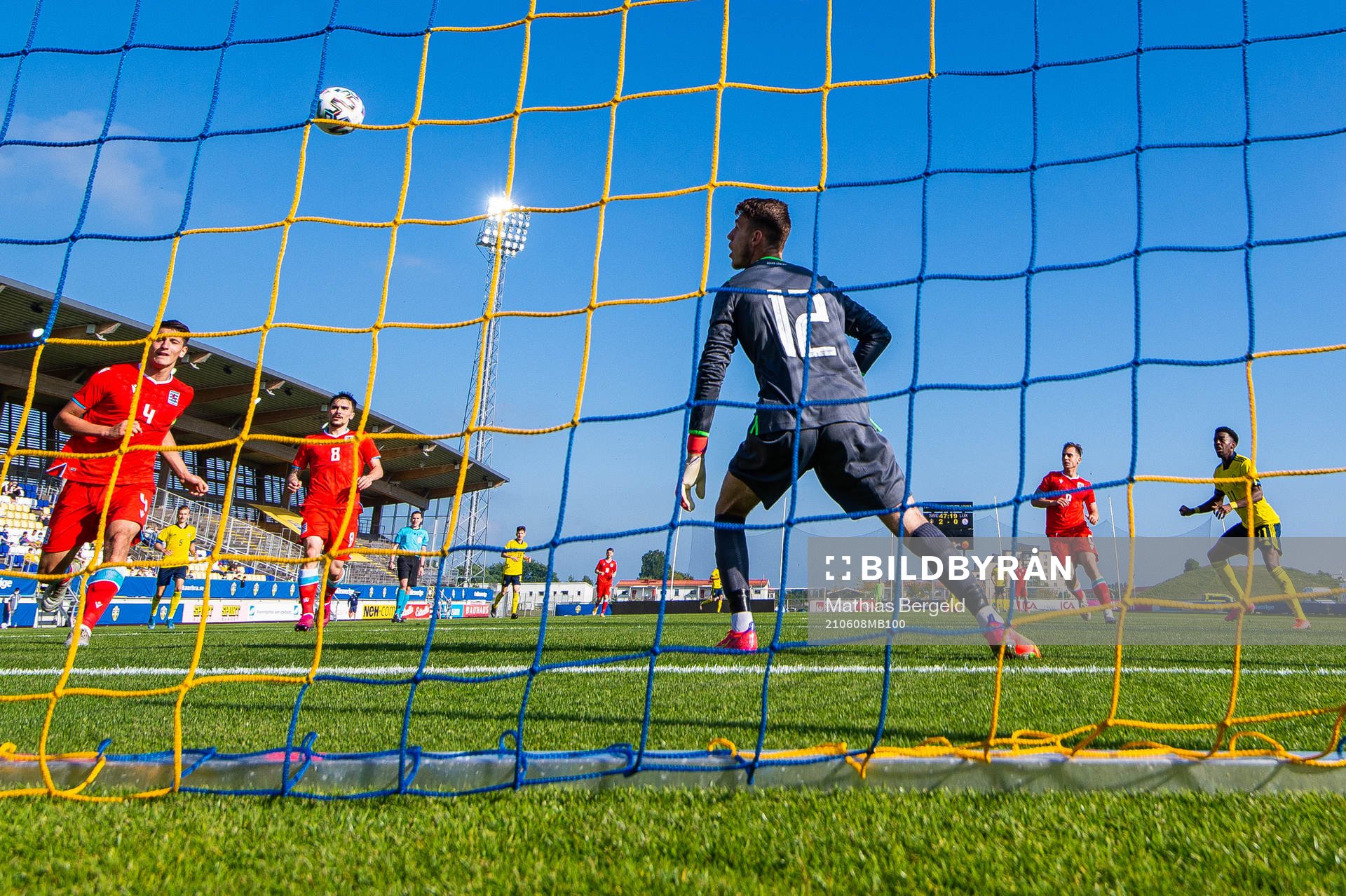Anthony Elanga of Sweden scores 3-0 behind goalkeeper