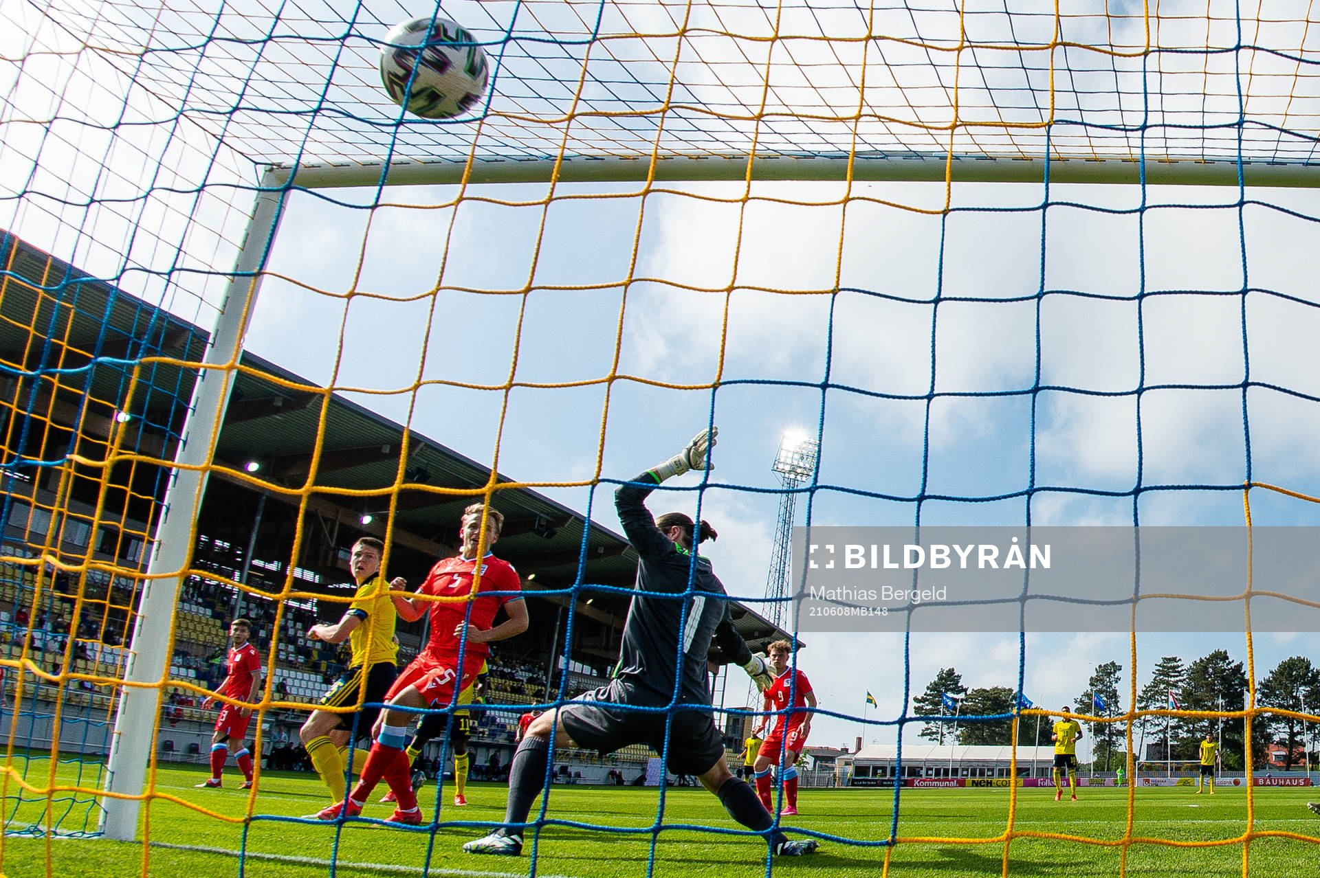 Emil Holm of Sweden scores 1-0 behind goalkeeper Tim Kips