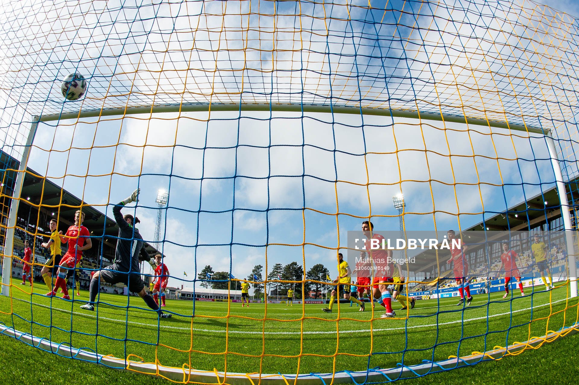 Emil Holm of Sweden scores 1-0 behind goalkeeper Tim Kips