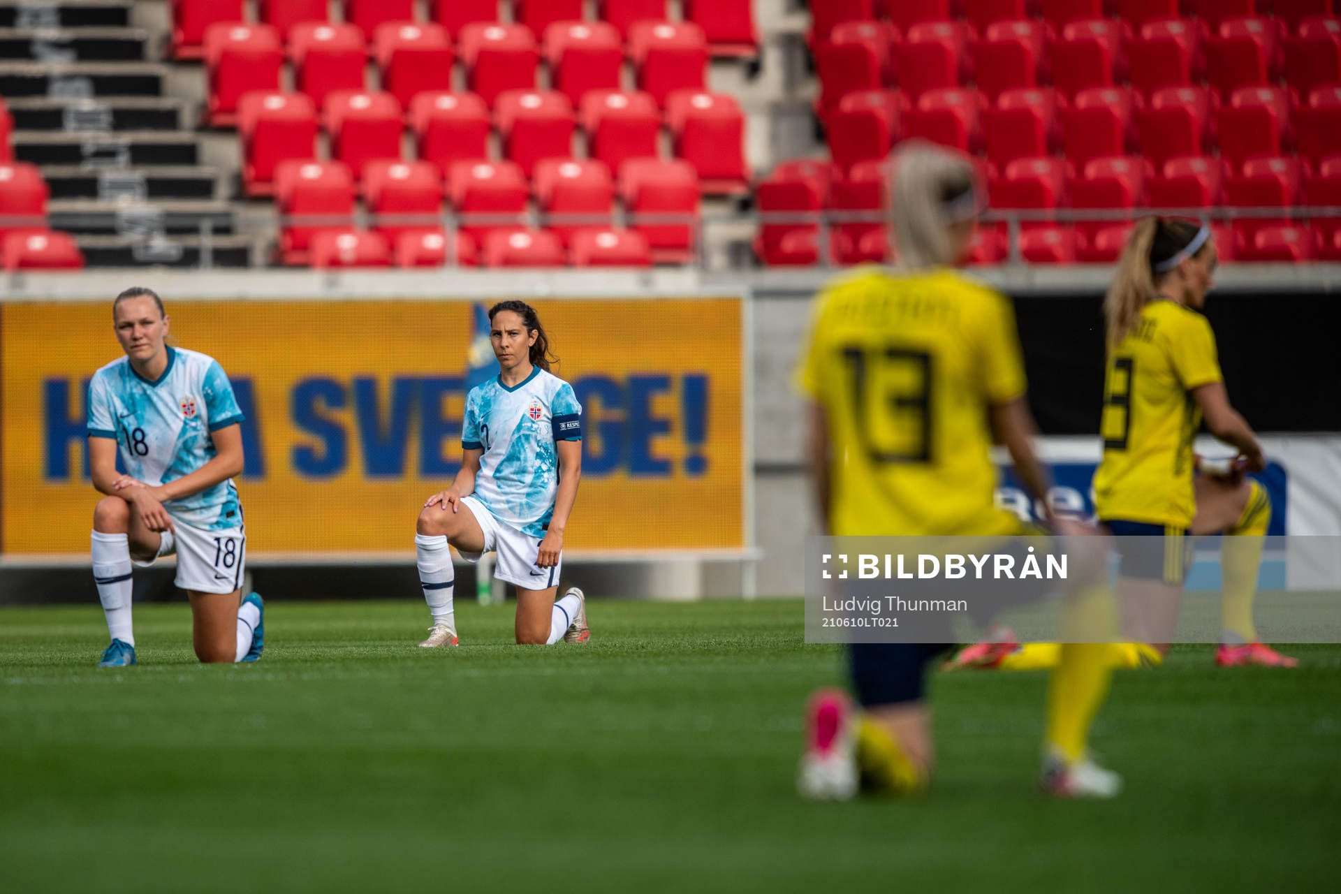 Frida Maanum and Ingrid Moe Wold of Norway takes a knee