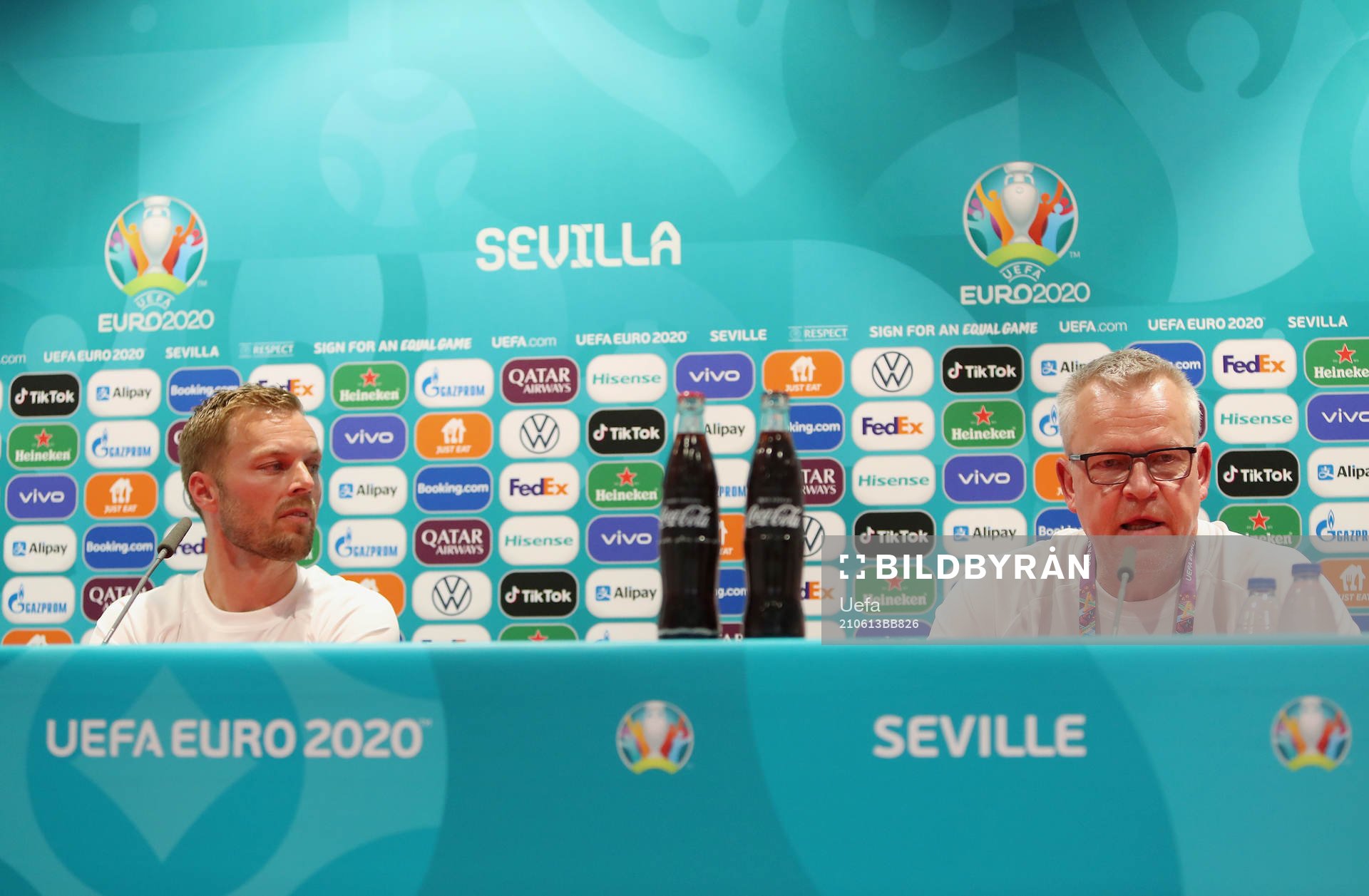 In this handout photo from UEFA Sebastian Larsson and head