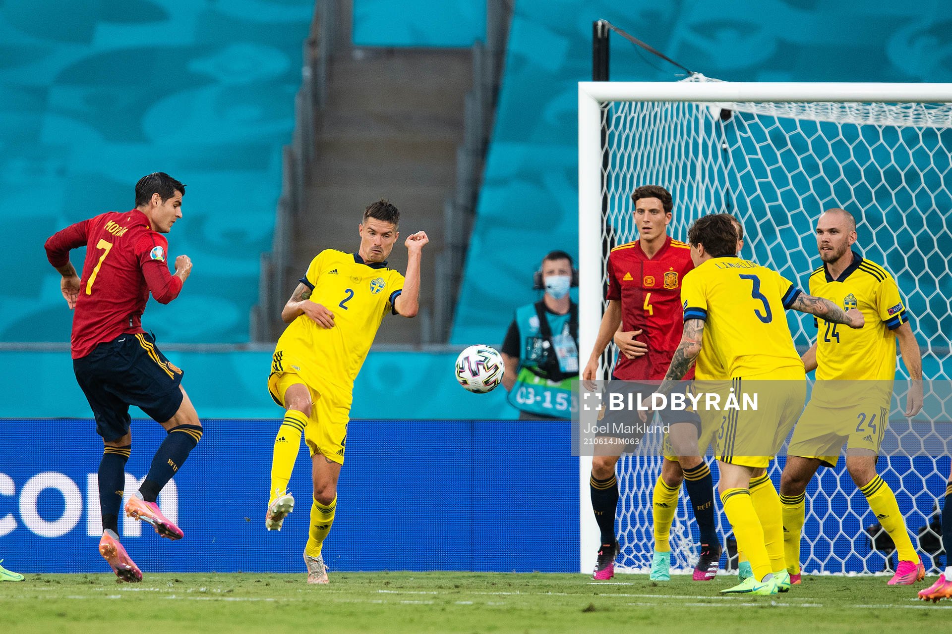 Alvaro Morata of Spain and Mikael Lustig of Sweden