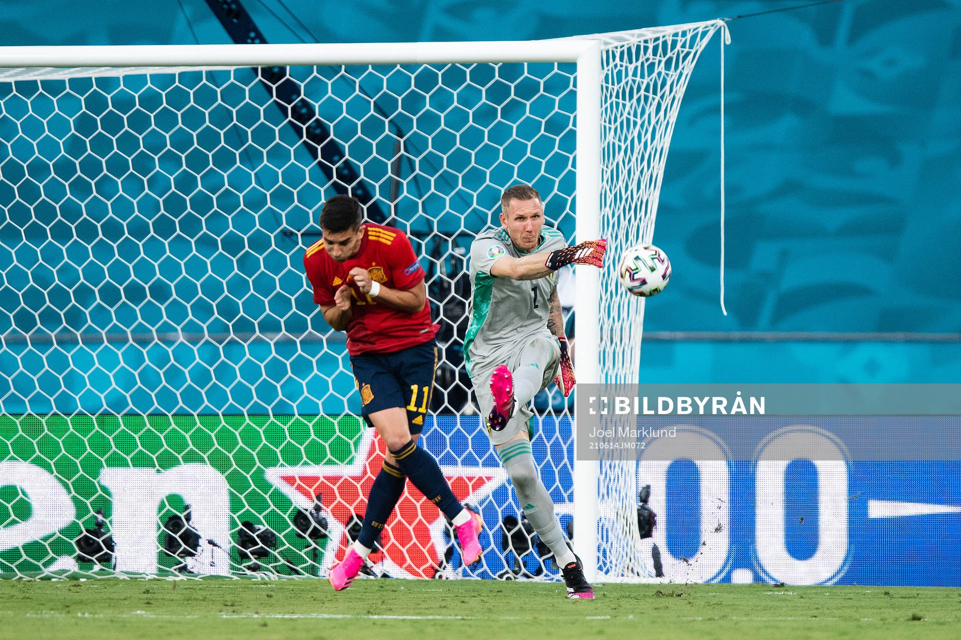 Ferran Torres of Spain and goalkeeper Robin Olsen of Sweden