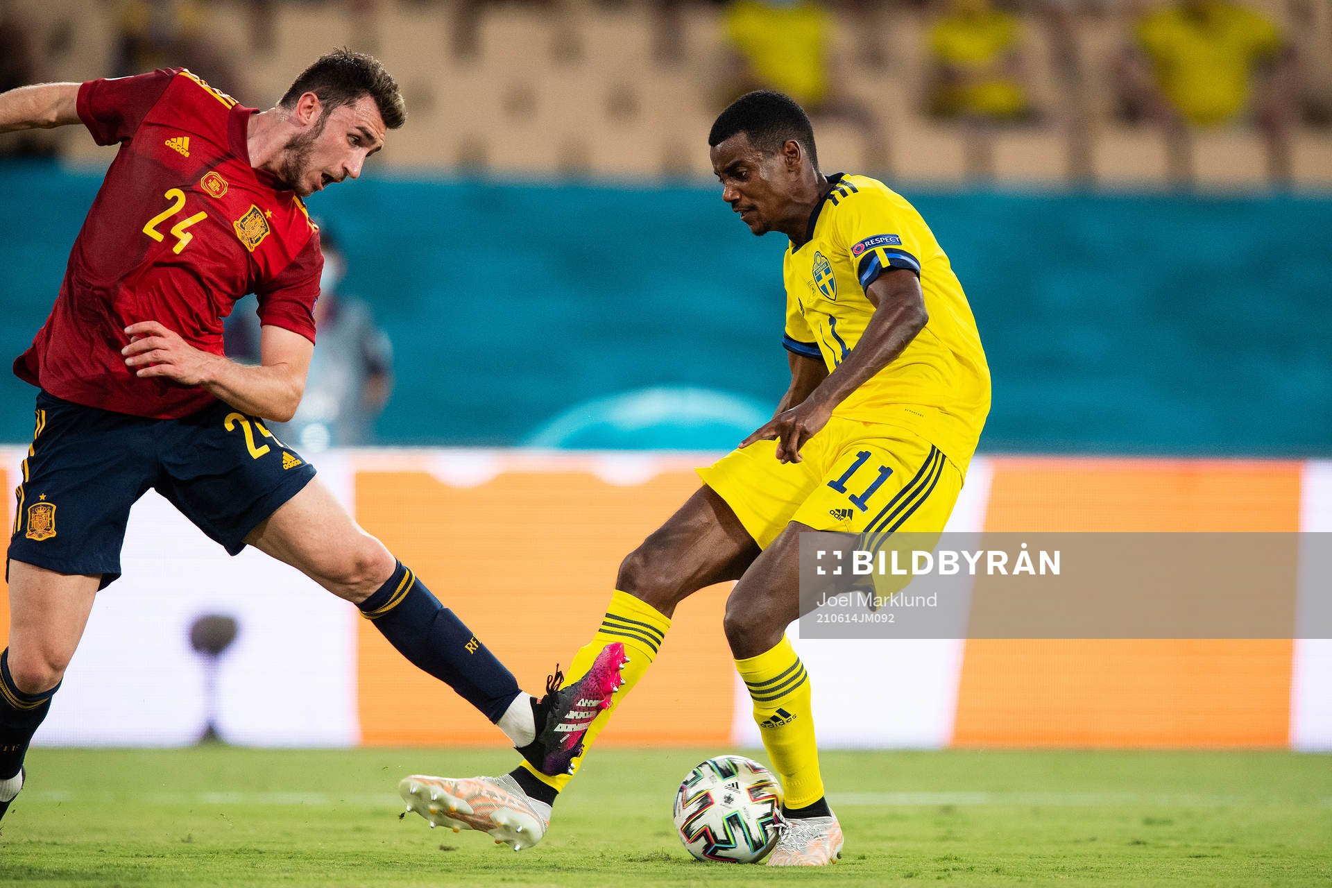 Aymeric Laporte of Spain and Alexander Isak of Sweden