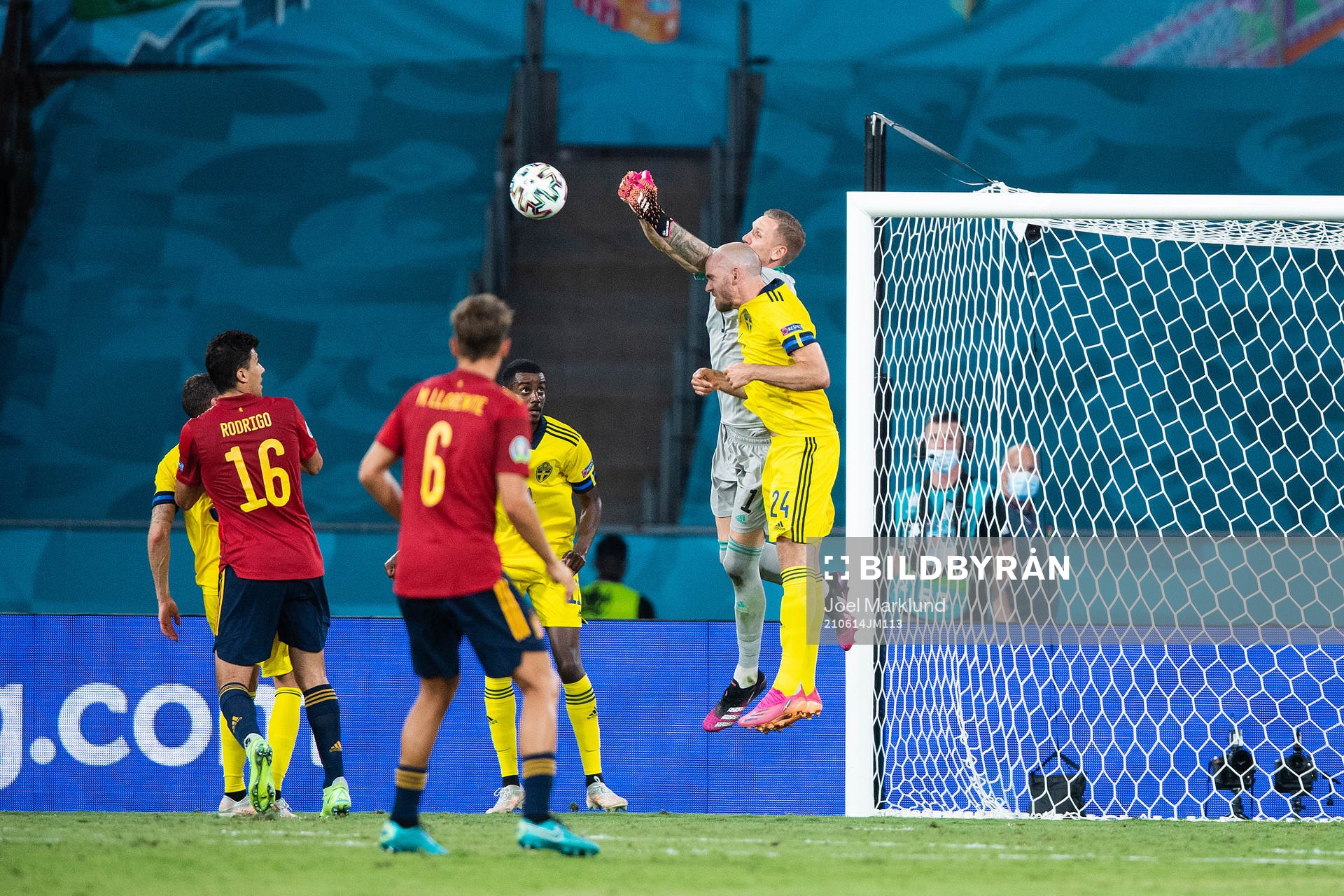goalkeeper Robin Olsen and Marcus Danielson of Sweden