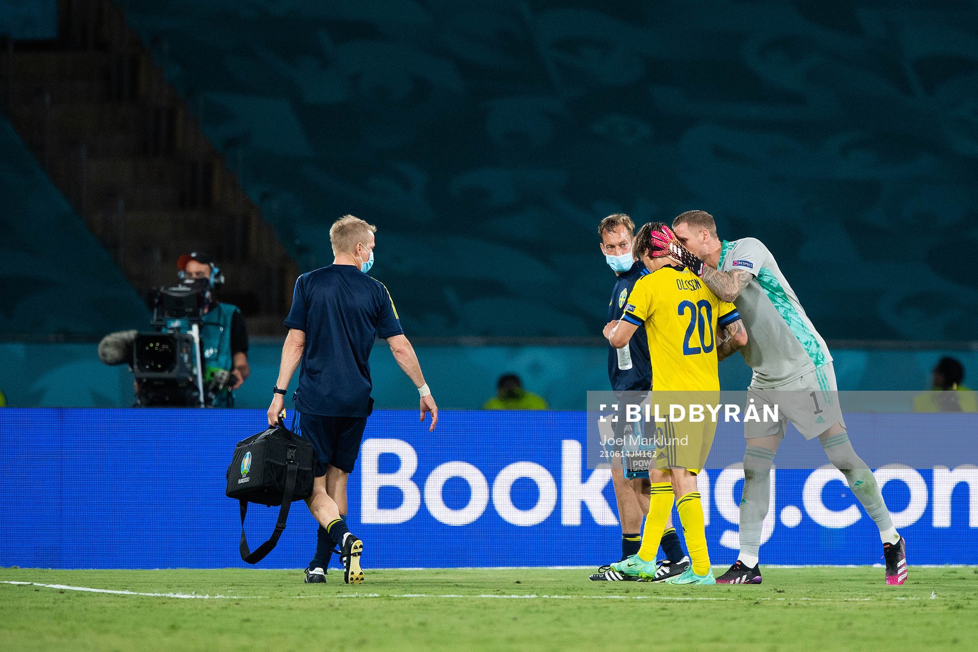 Kristoffer Olsson and goalkeeper Robin Olsen of Sweden