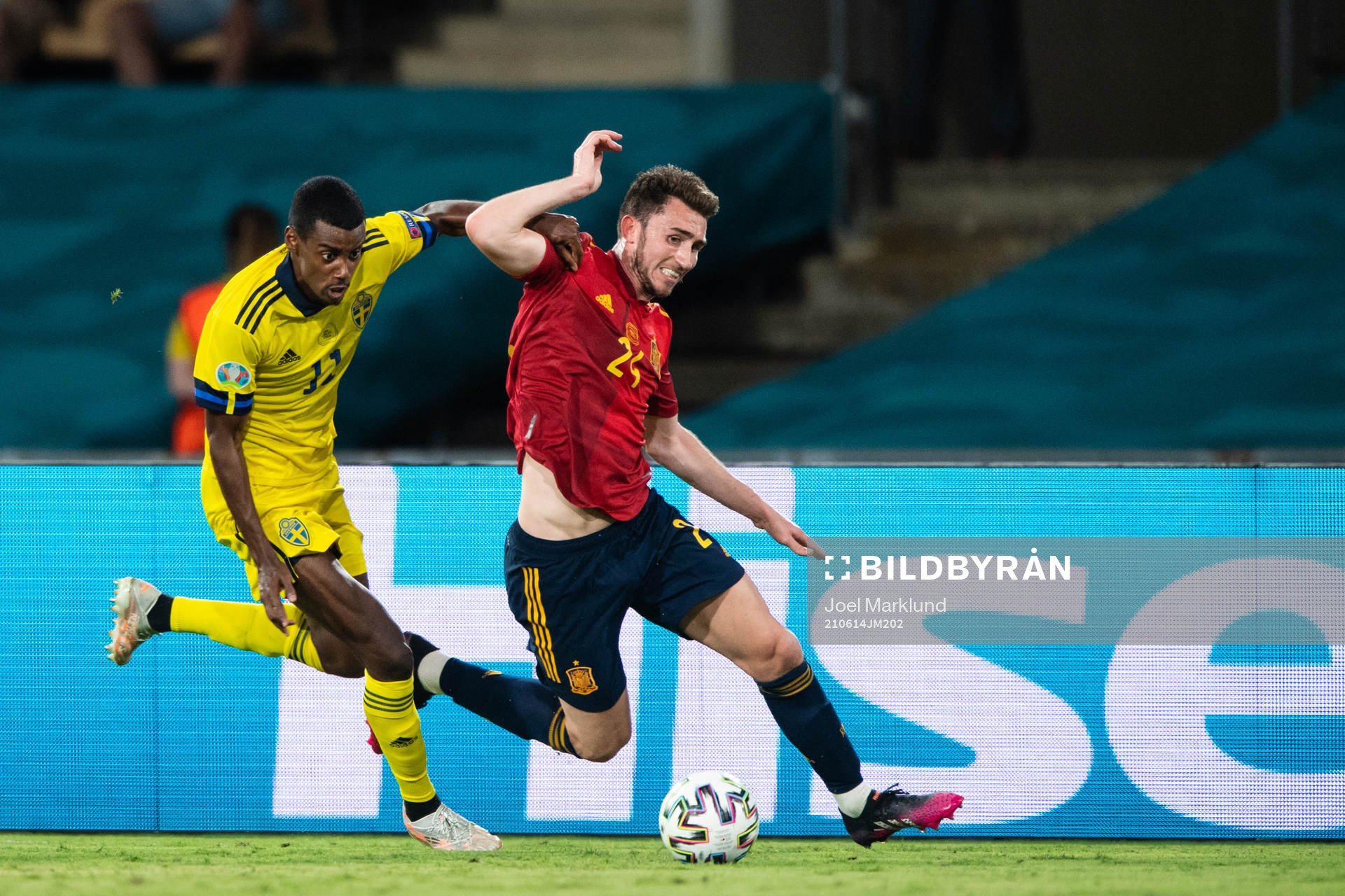 Alexander Isak of Sweden and Aymeric Laporte of Spain