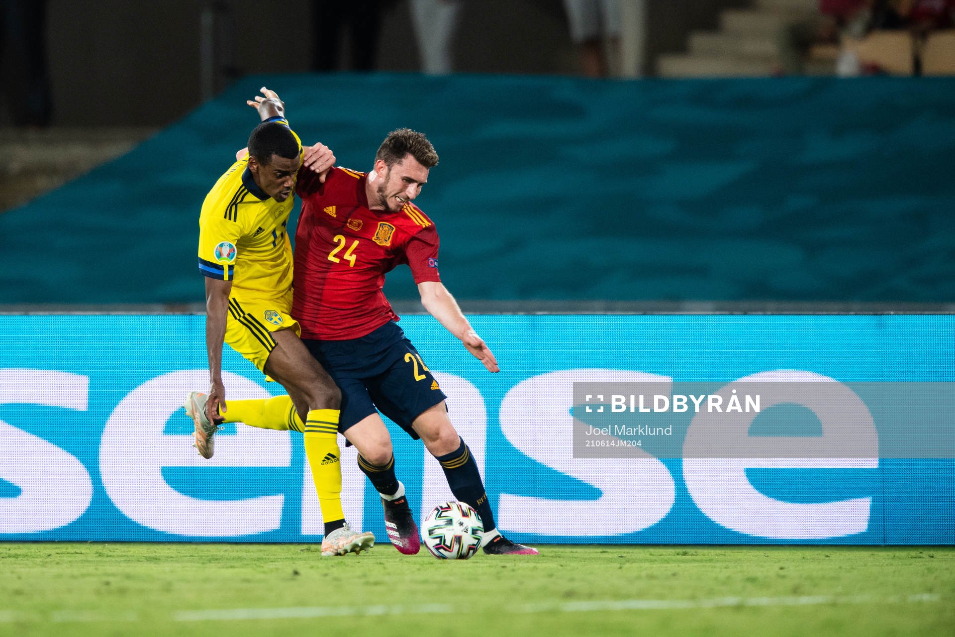 Alexander Isak of Sweden and Aymeric Laporte of Spain