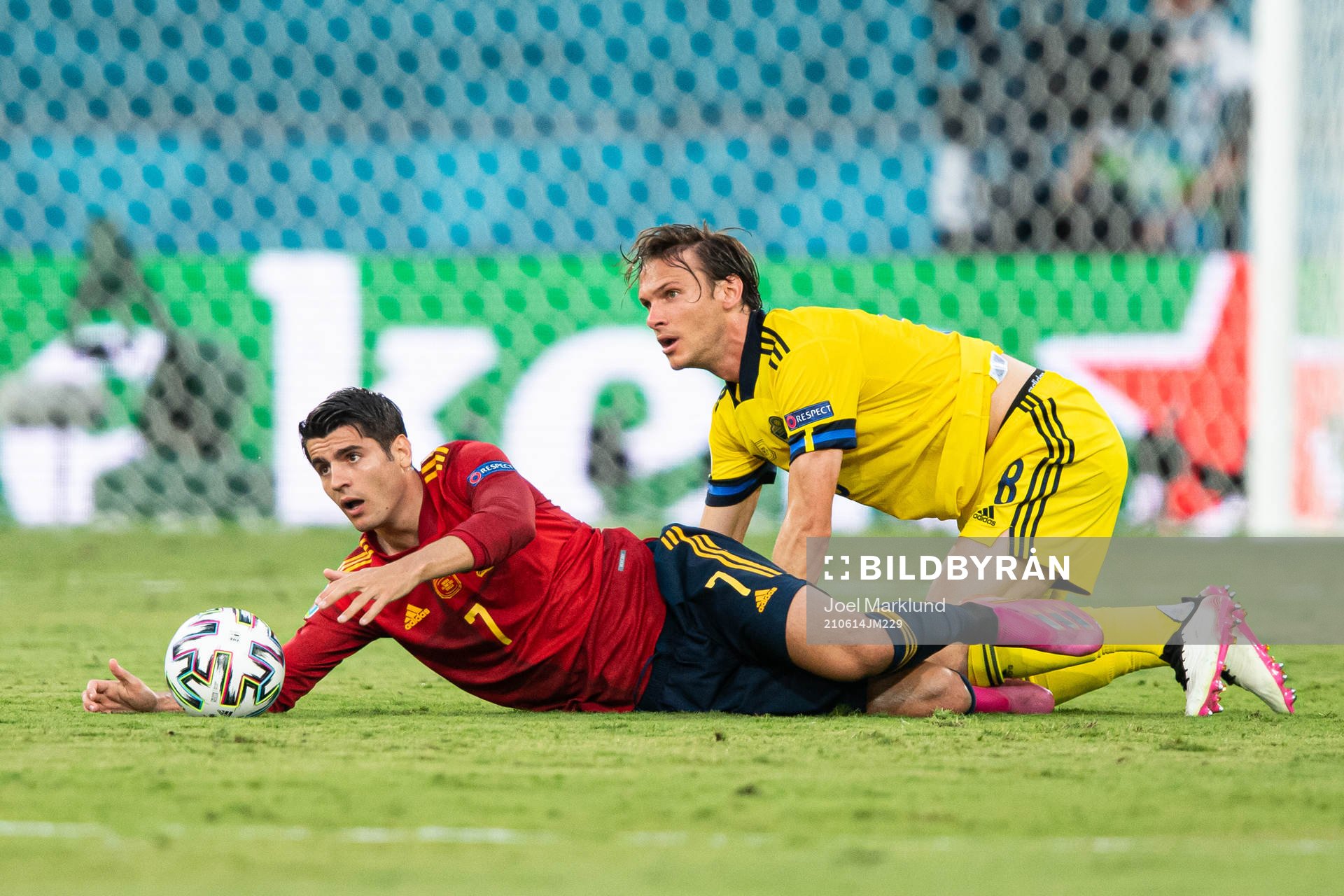 Alvaro Morata of Spain and Albin Ekdal of Sweden