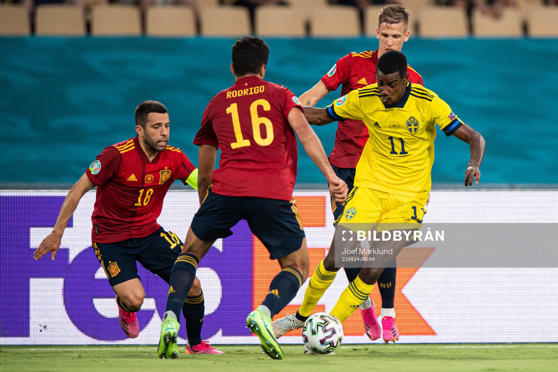 Jordi Alba, Rodri and Dani Olmo of Spain are challenged by Alexander Isak of Sweden during the UEFA Euro 2020 Football Championship match between Spain and Sweden on June 14, 2021 in Seville.