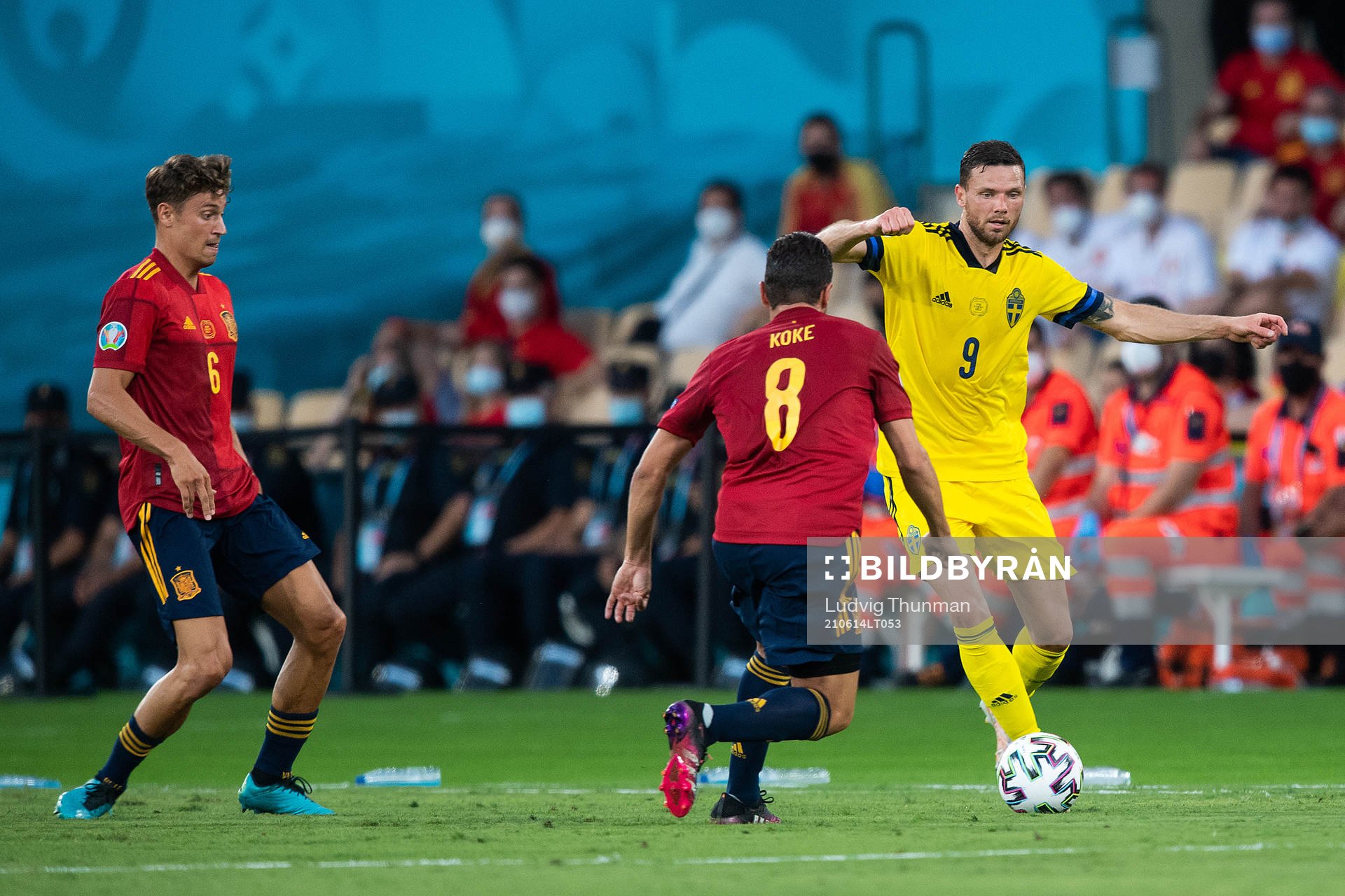 Koke Koke of Spain and Marcus Berg of Sweden