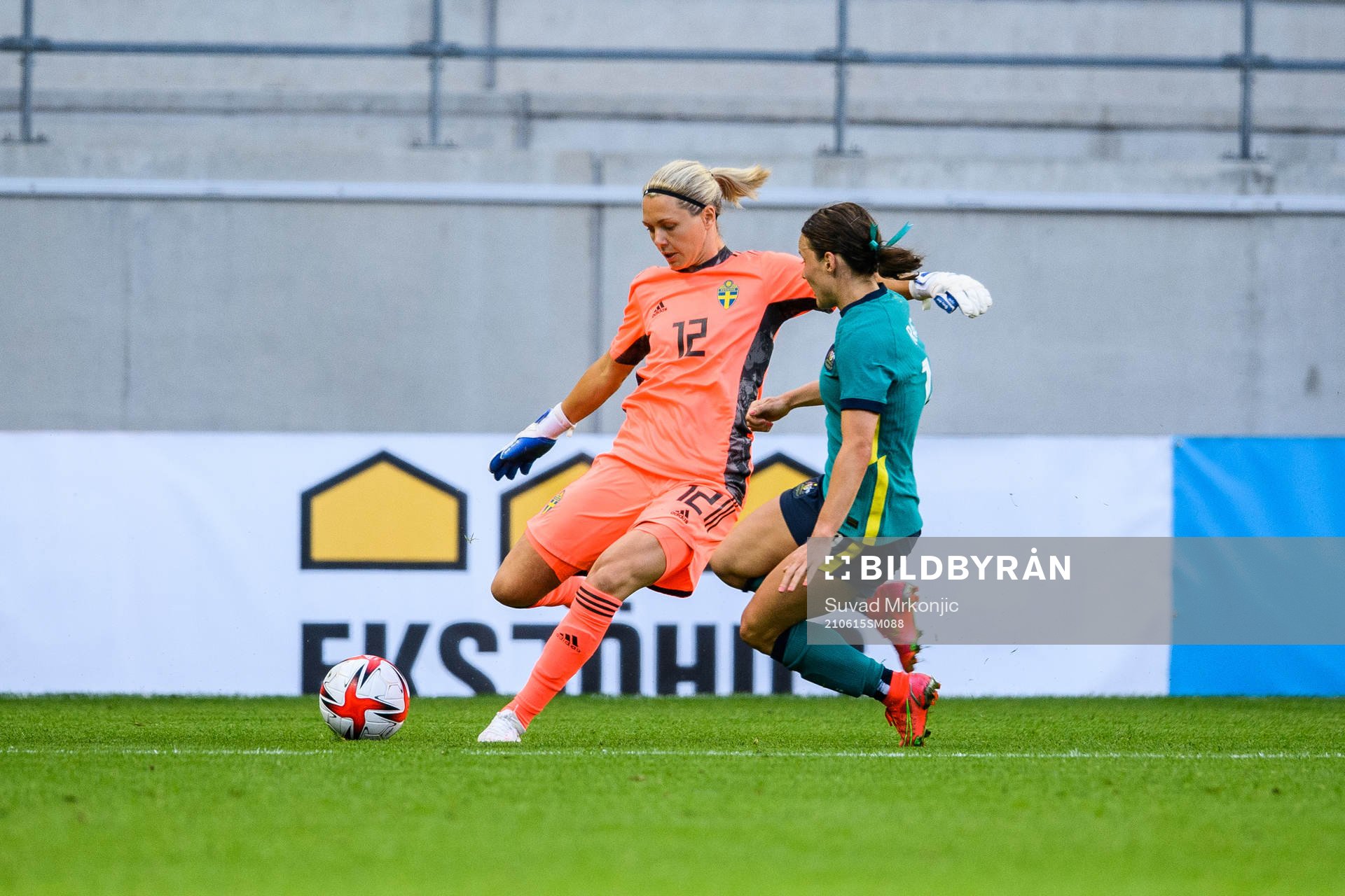 goalkeeper Jennifer Falk of Sweden and Hayley Raso of