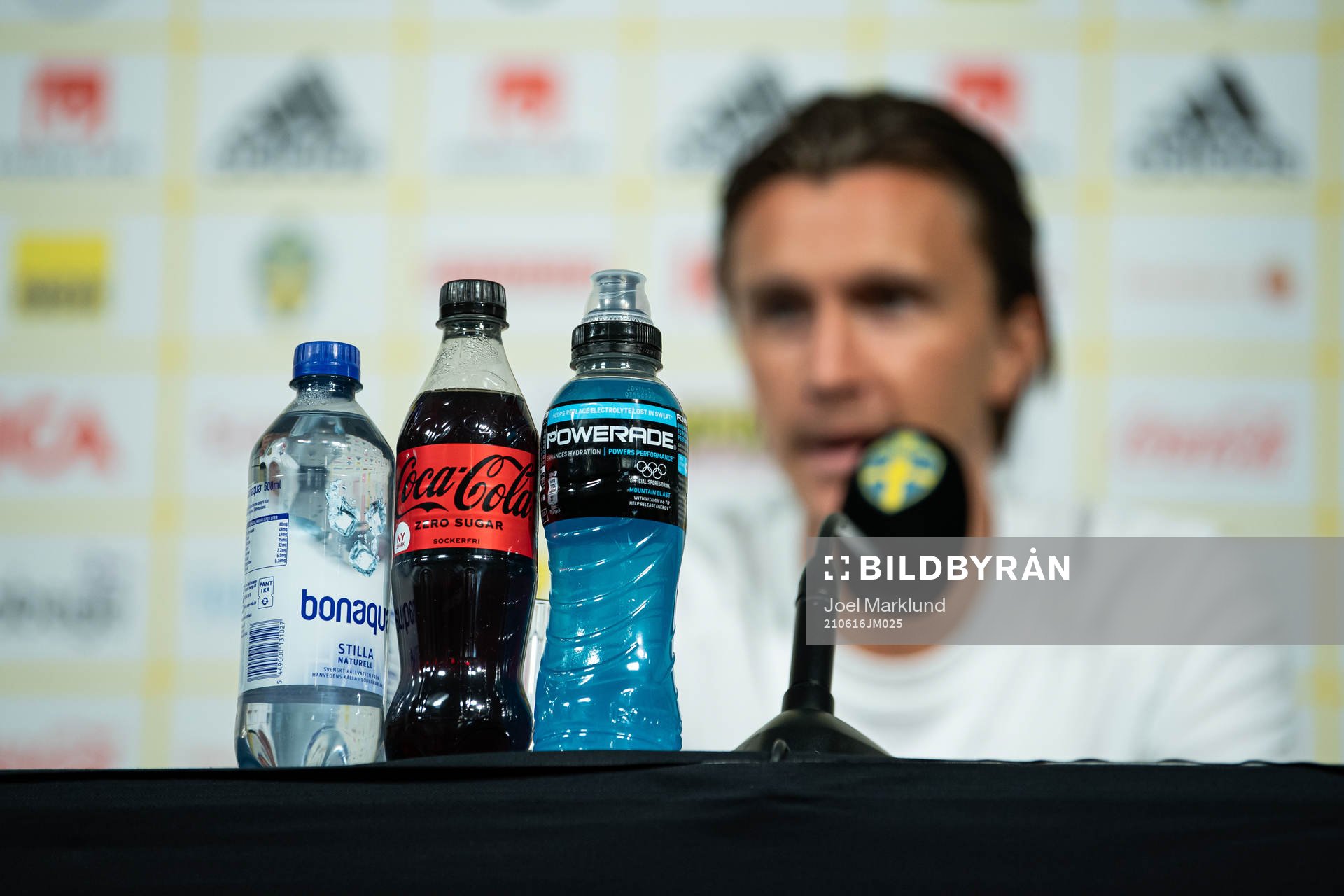 Sponsored bottles in front of Kristoffer Olsson of the