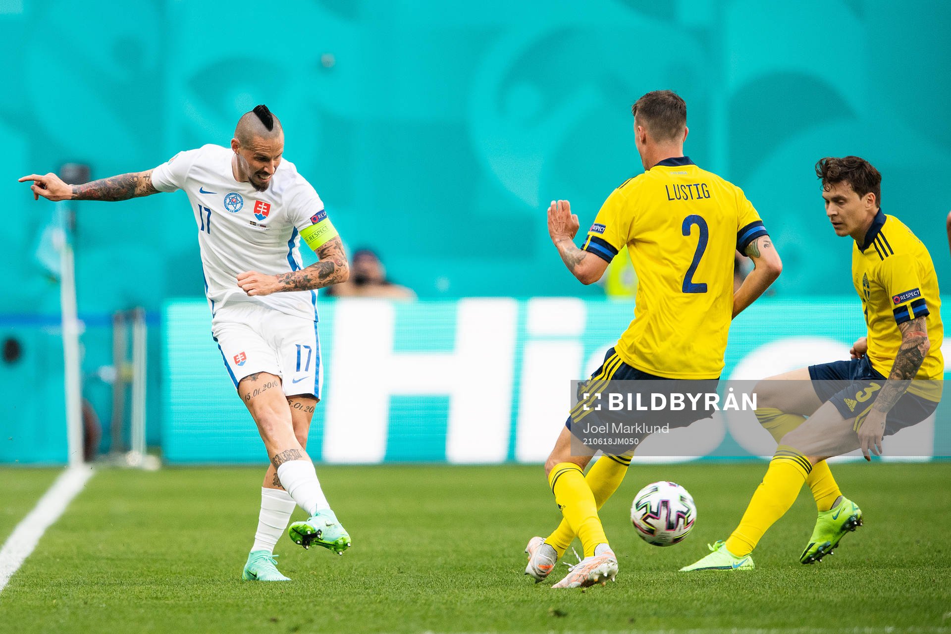 Marek Hamsik of Slovakia against Mikael Lustig and Victor