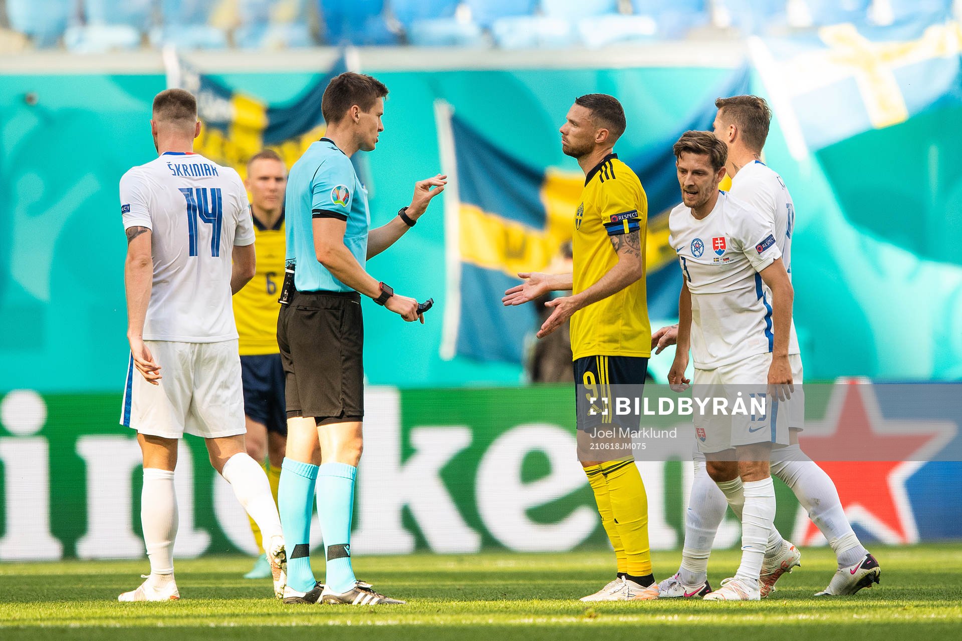referee Daniel Siebert and Marcus Berg of Sweden