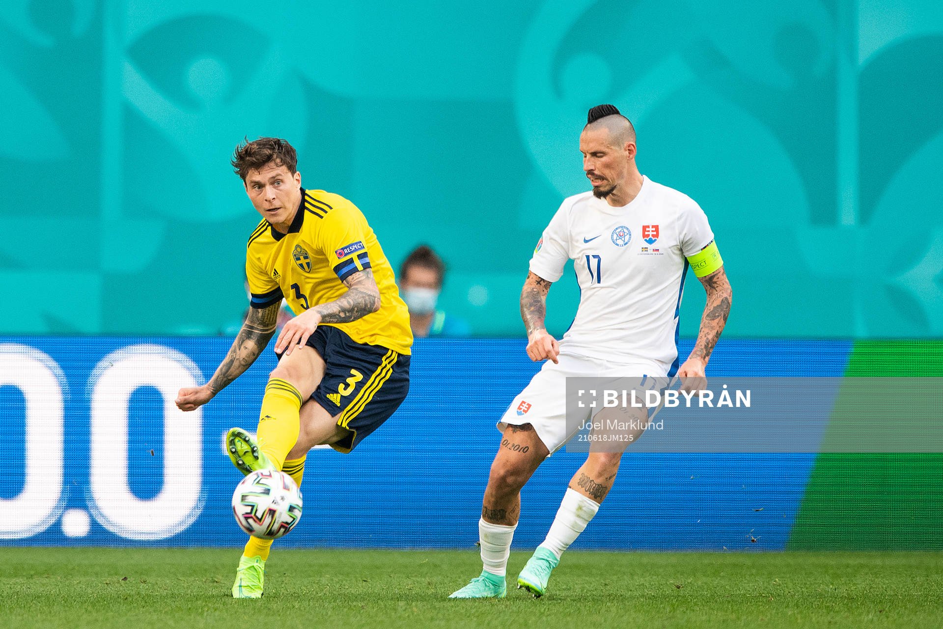 Victor Nilsson Lindelöf of Sweden and Marek Hamsik of