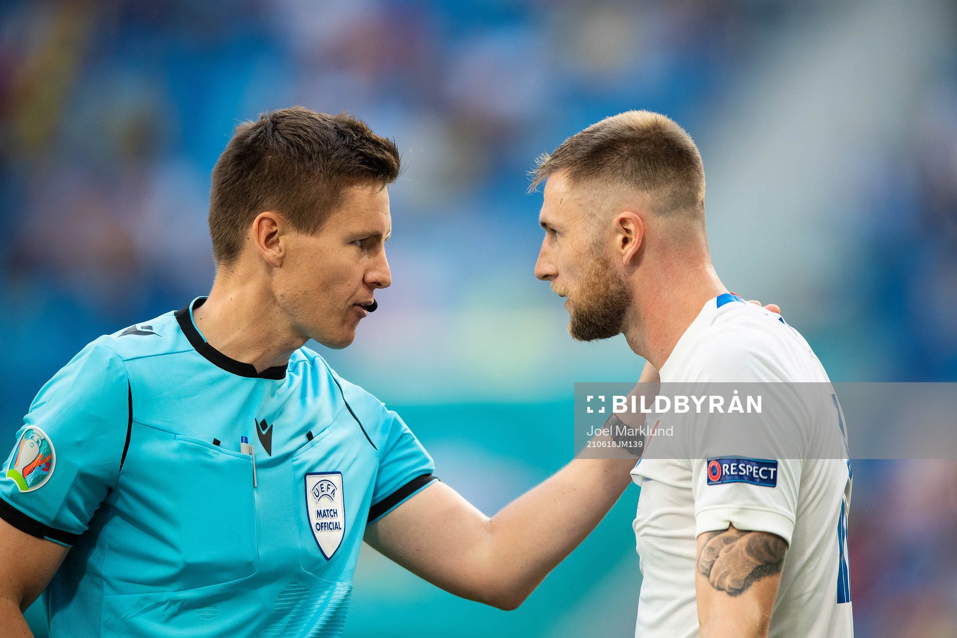 referee Daniel Siebert and Milan Skriniar of Slovakia