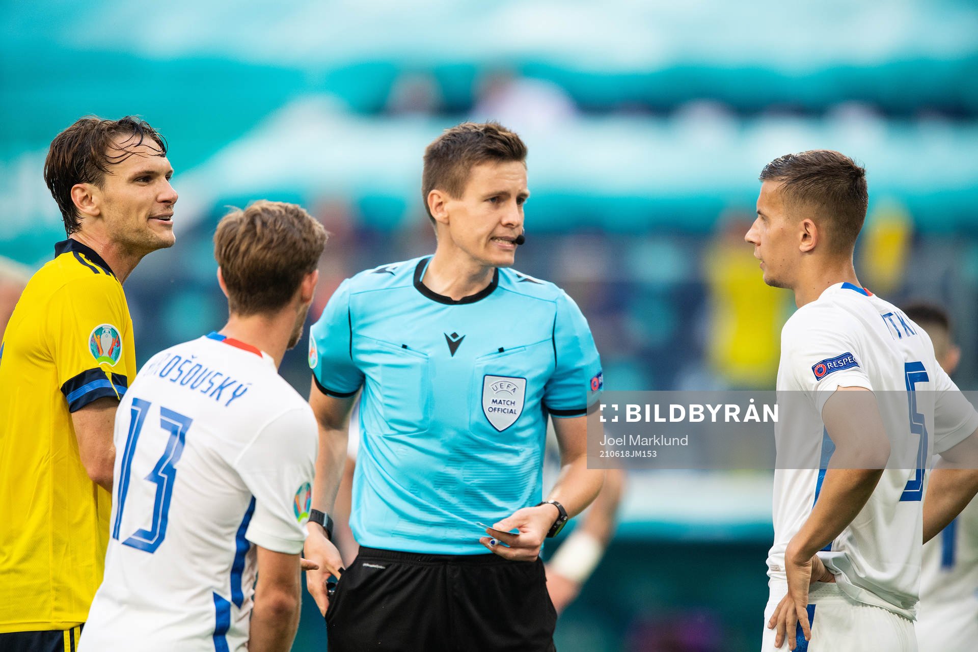 Albin Ekdal of Sweden, referee Daniel Siebert and Patrik
