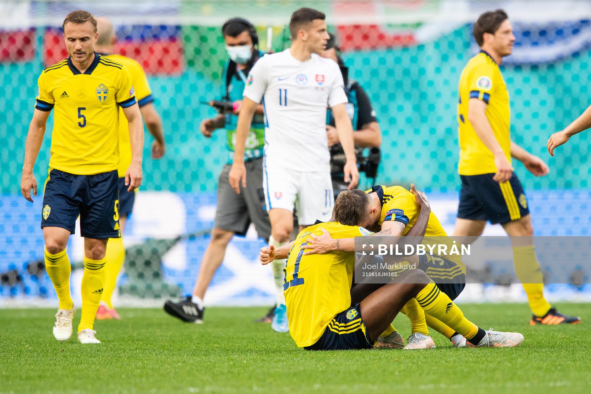 Alexander Isak and Mikael Lustig of Sweden celebrate