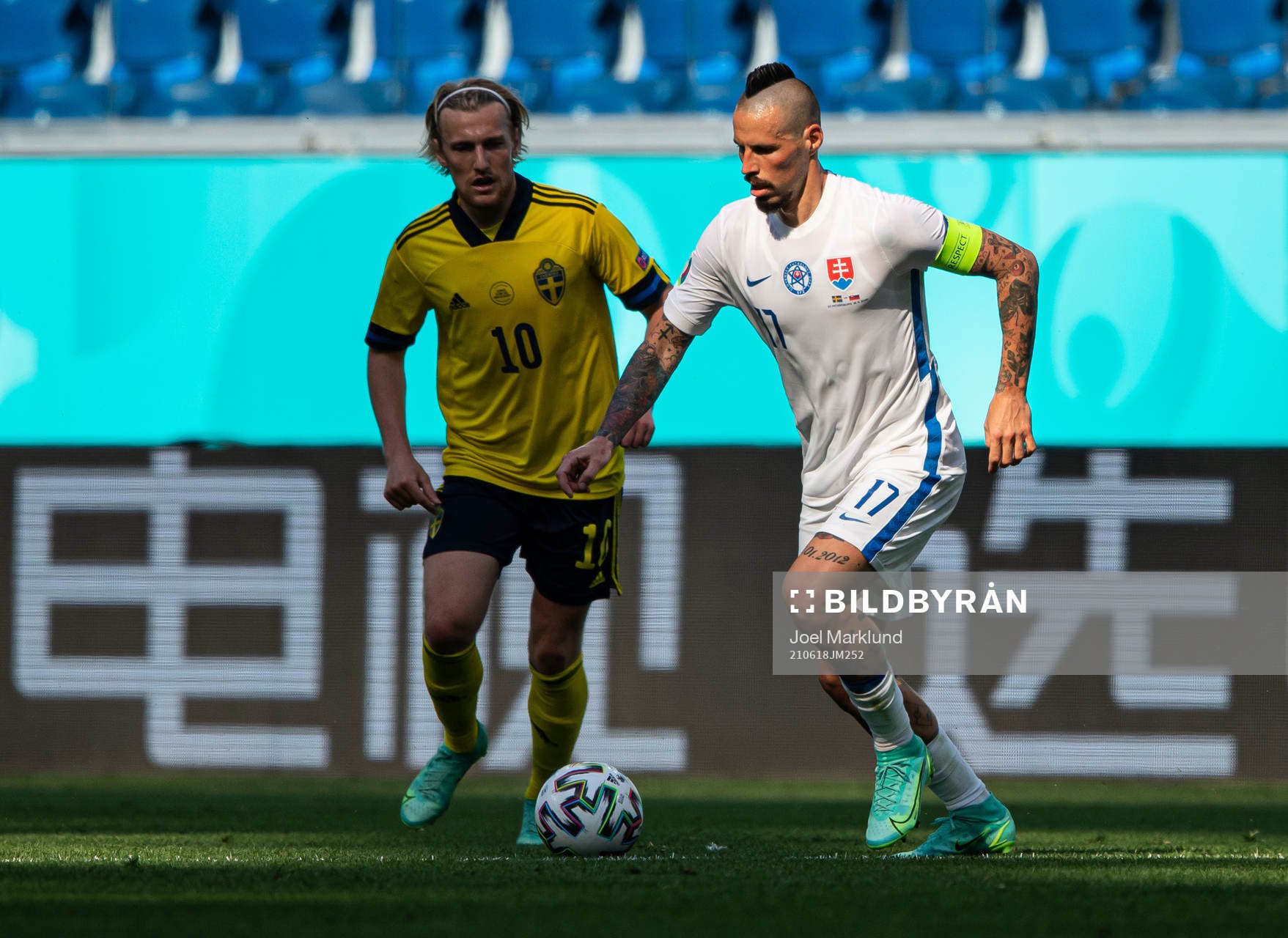 Emil Forsberg of Sweden and Marek Hamsik of Slovakia