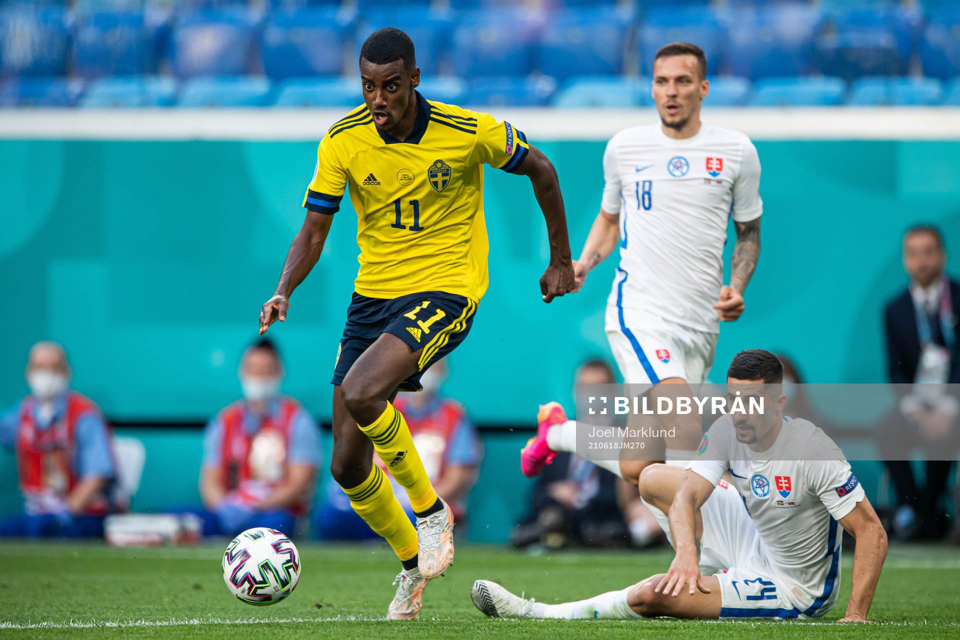 Alexander Isak of Sweden dribbles past Martin Koscelnik of