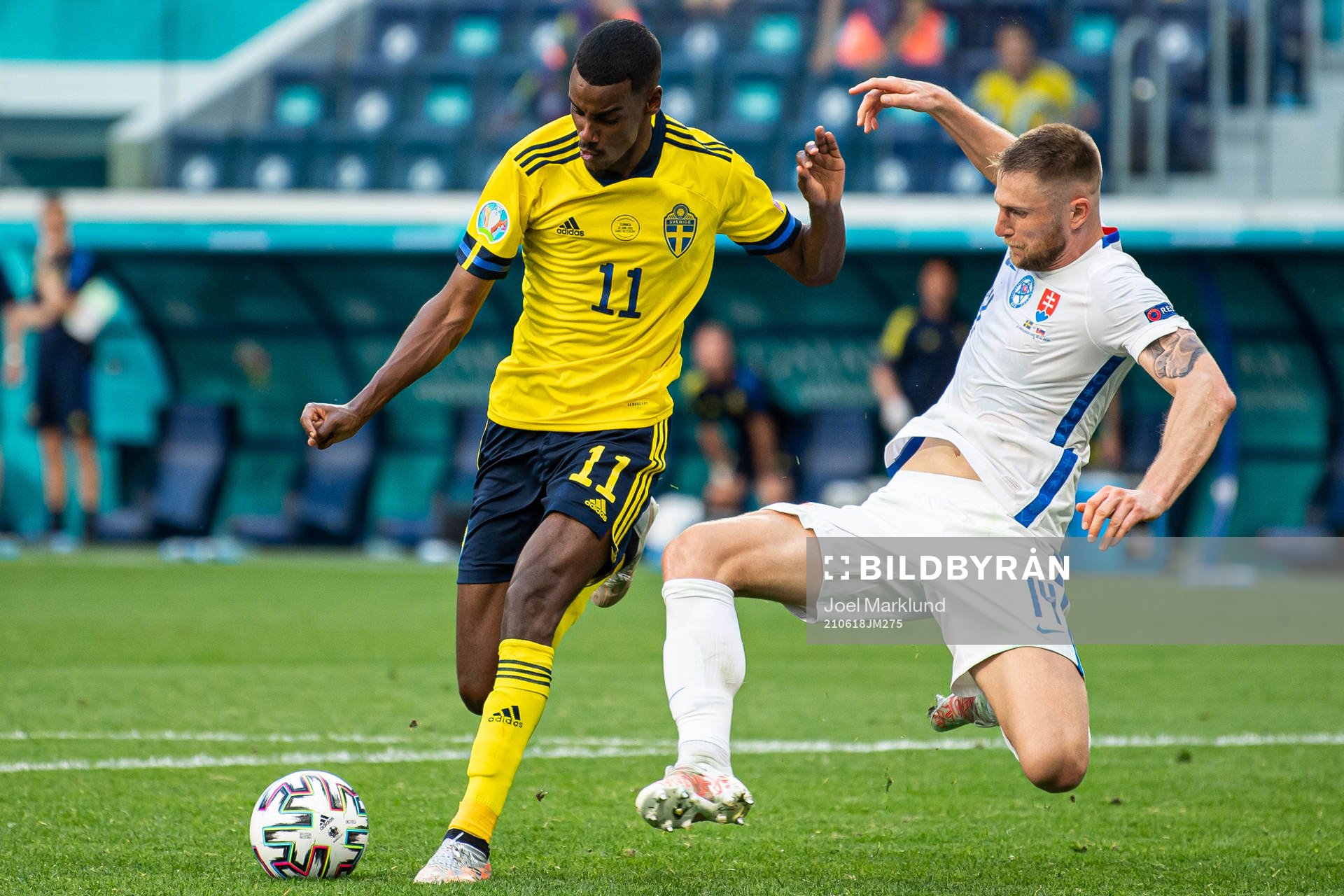 Alexander Isak of Sweden and Milan Skriniar of Slovakia