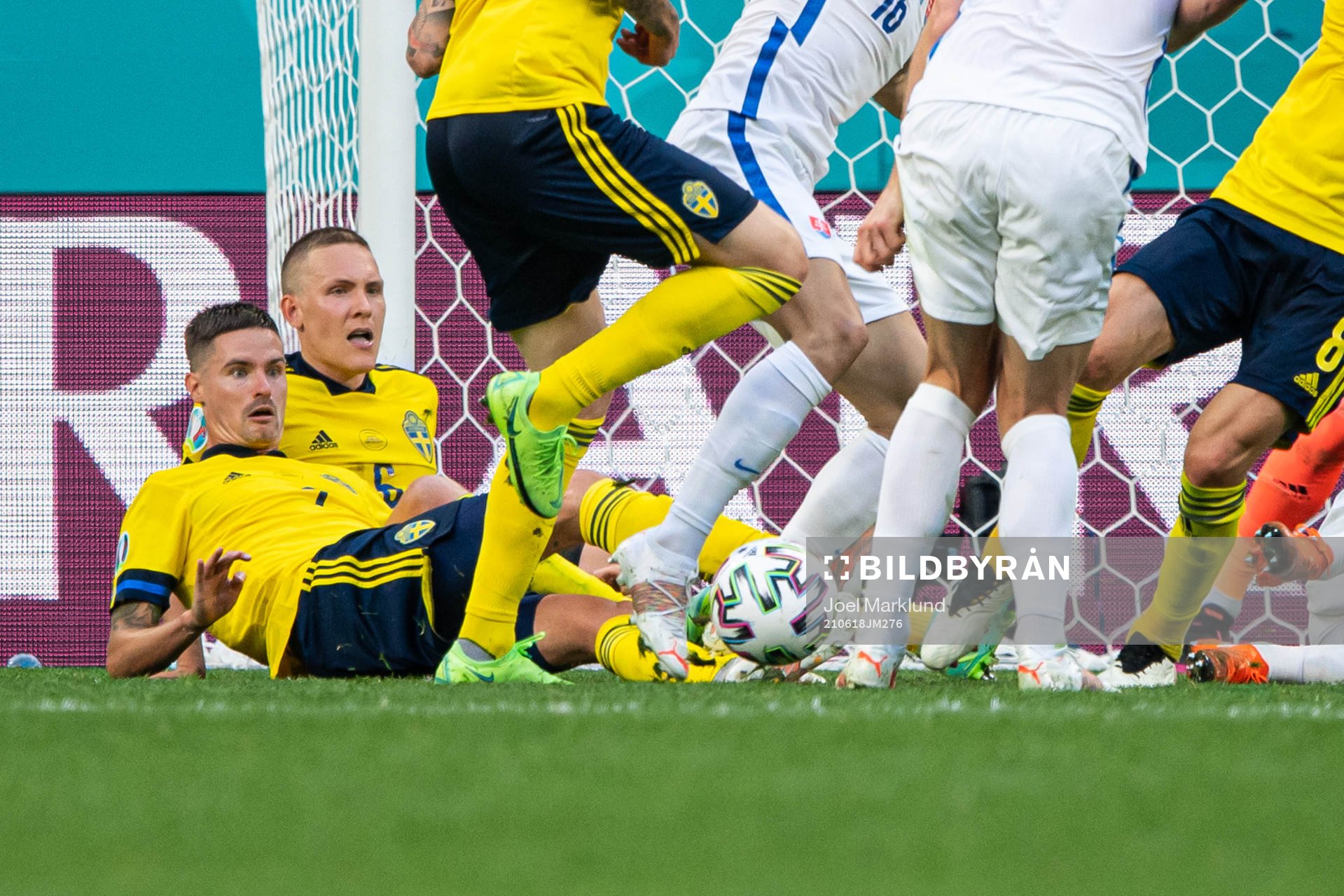Mikael Lustig and Ludwig Augustinsson of Sweden see players
