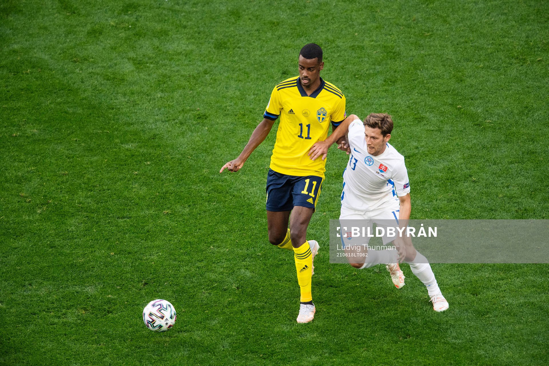 Alexander Isak of Sweden and Patrik Hrosovsky of Slovakia