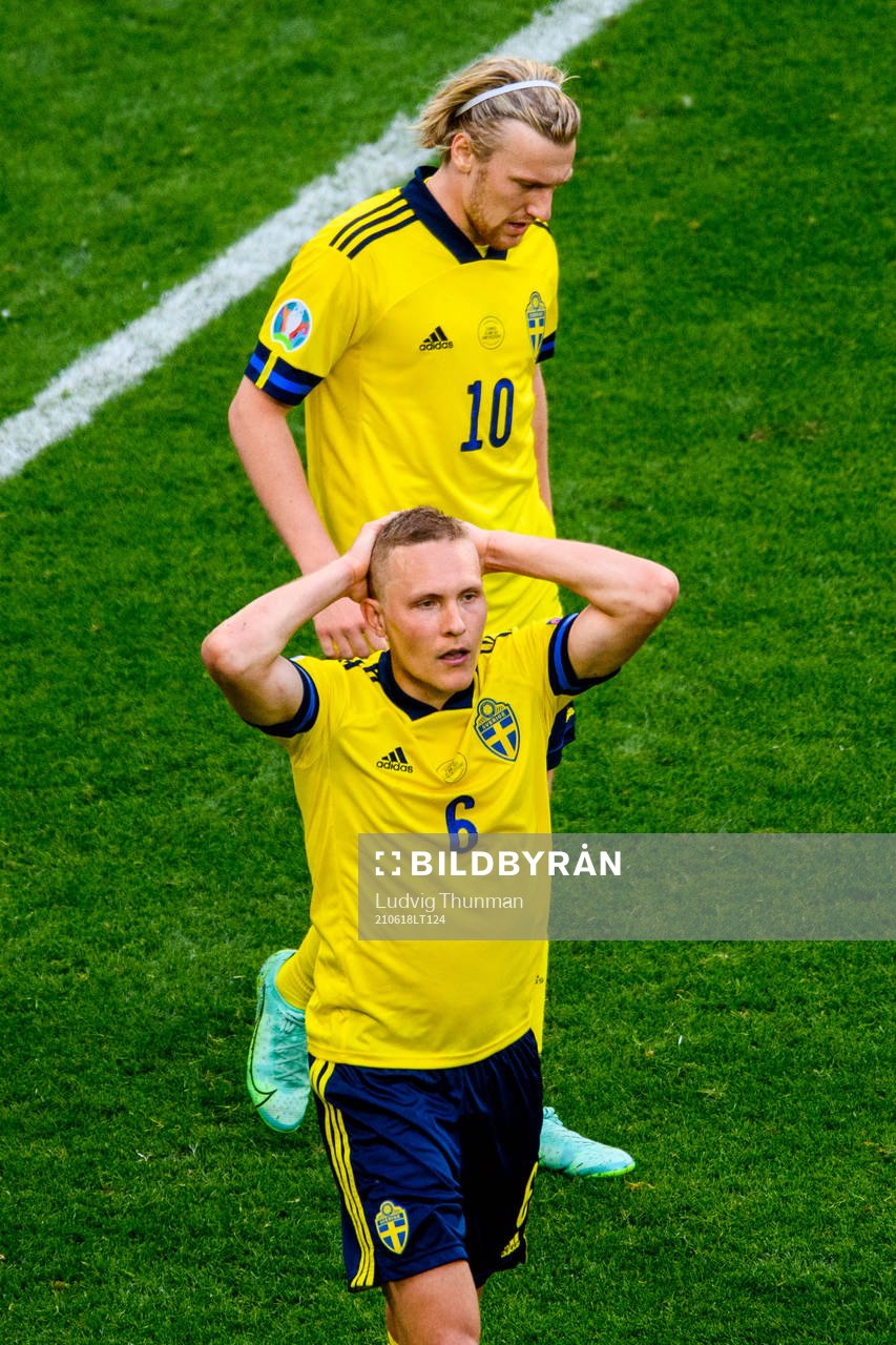 Ludwig Augustinsson and Emil Forsberg of Sweden looks