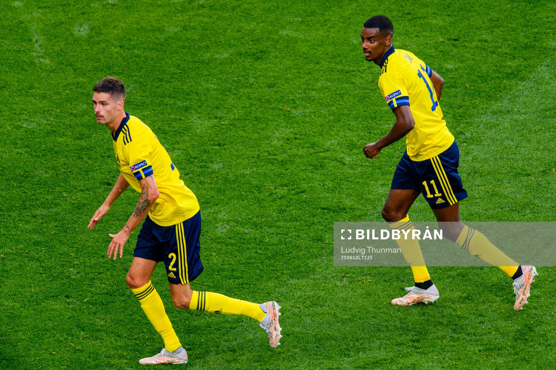 Mikael Lustig and Alexander Isak of Sweden