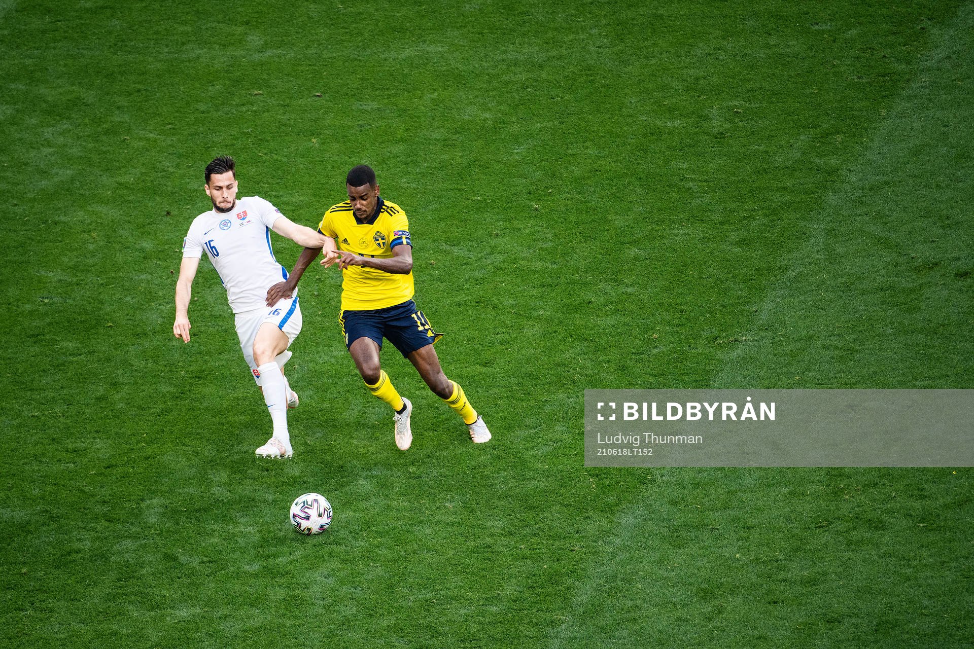 David Hancko of Slovakia and Alexander Isak of Sweden