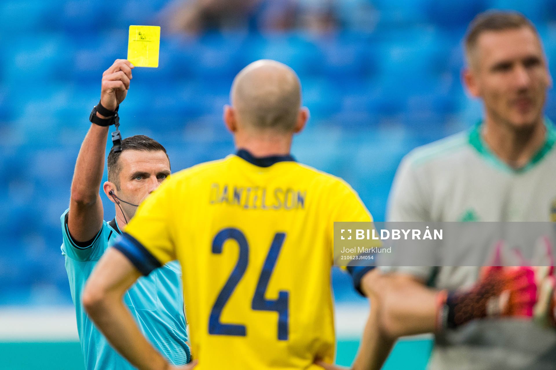 Marcus Danielson of Sweden is shown a yellow card by