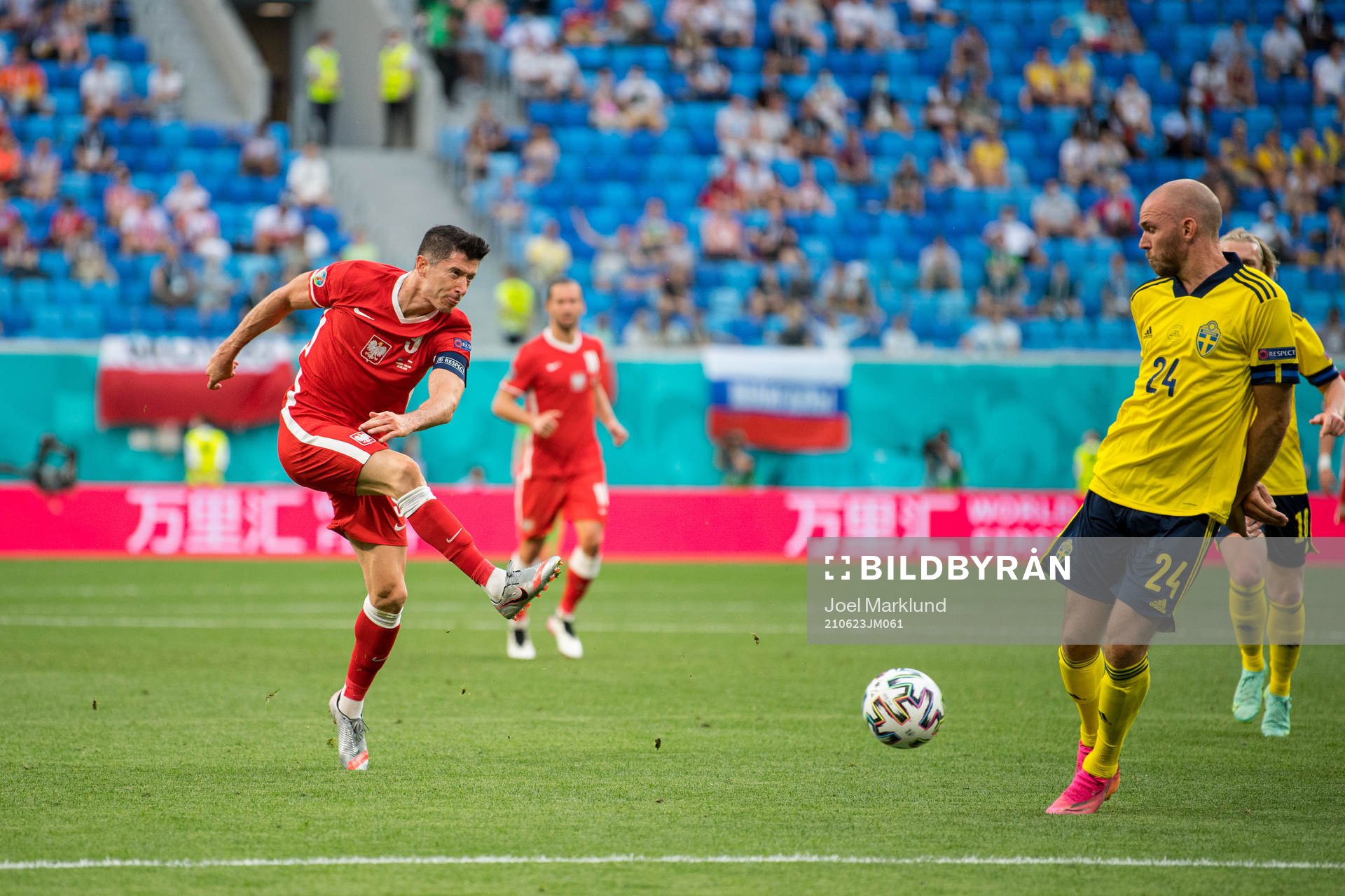 Robert Lewandowski of Poland and Marcus Danielson of Sweden