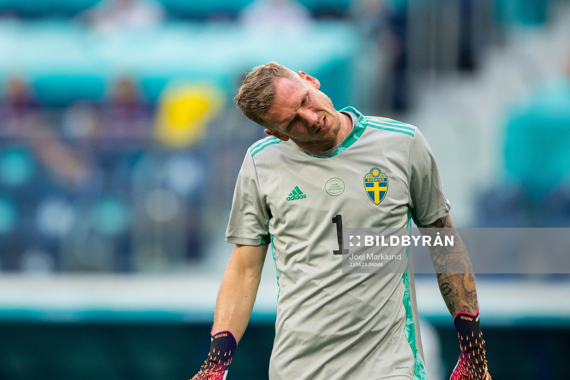 Goalkeeper Robin Olsen of Sweden in pain
