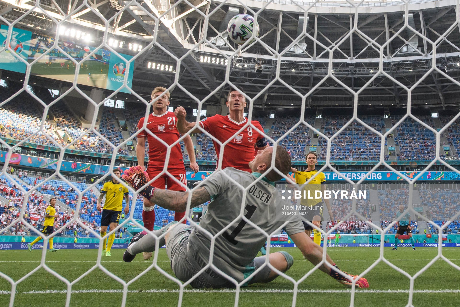 Robert Lewandowski of Poland attacks in front of goalkeeper