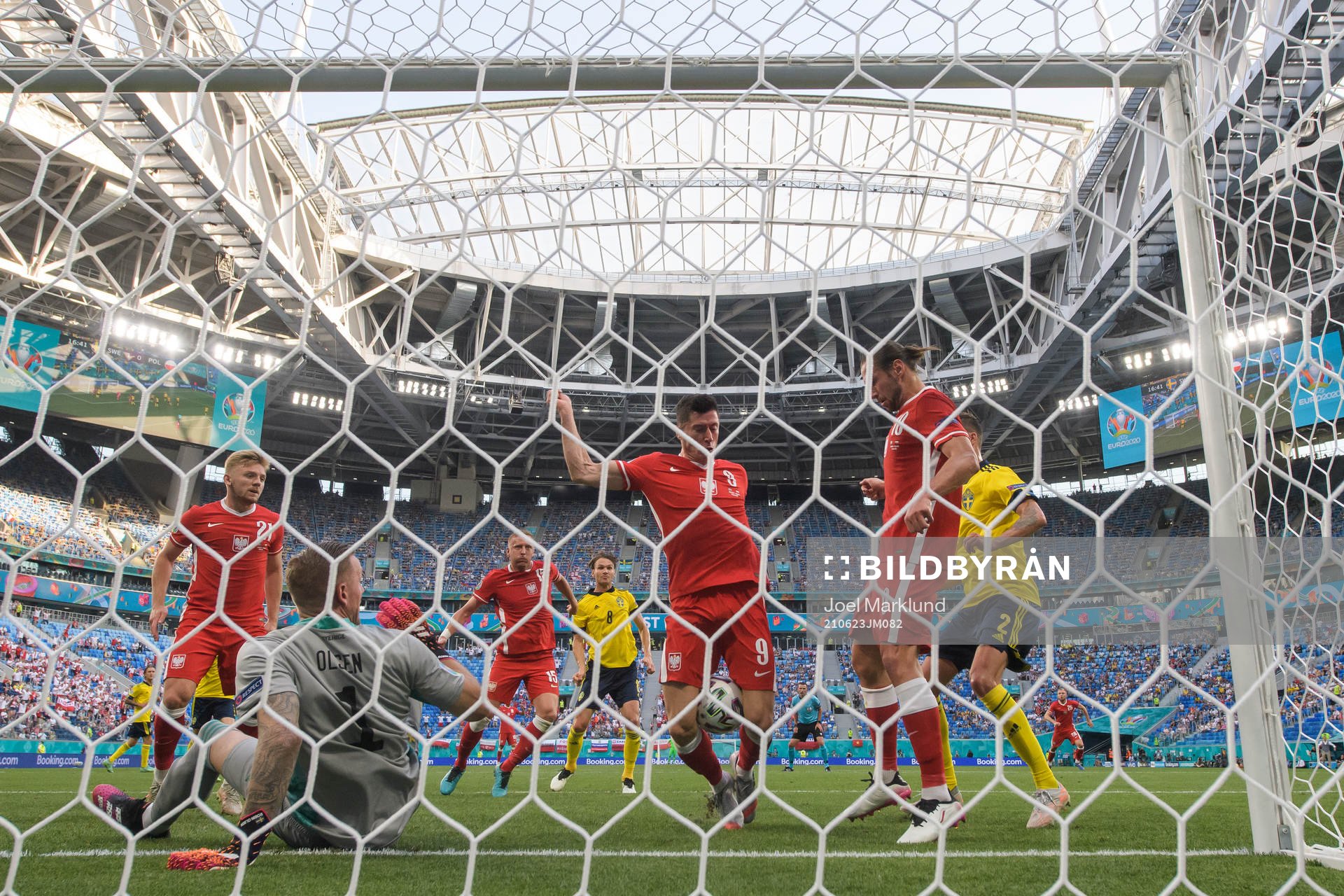 Robert Lewandowski of Poland attacks in front of goalkeeper