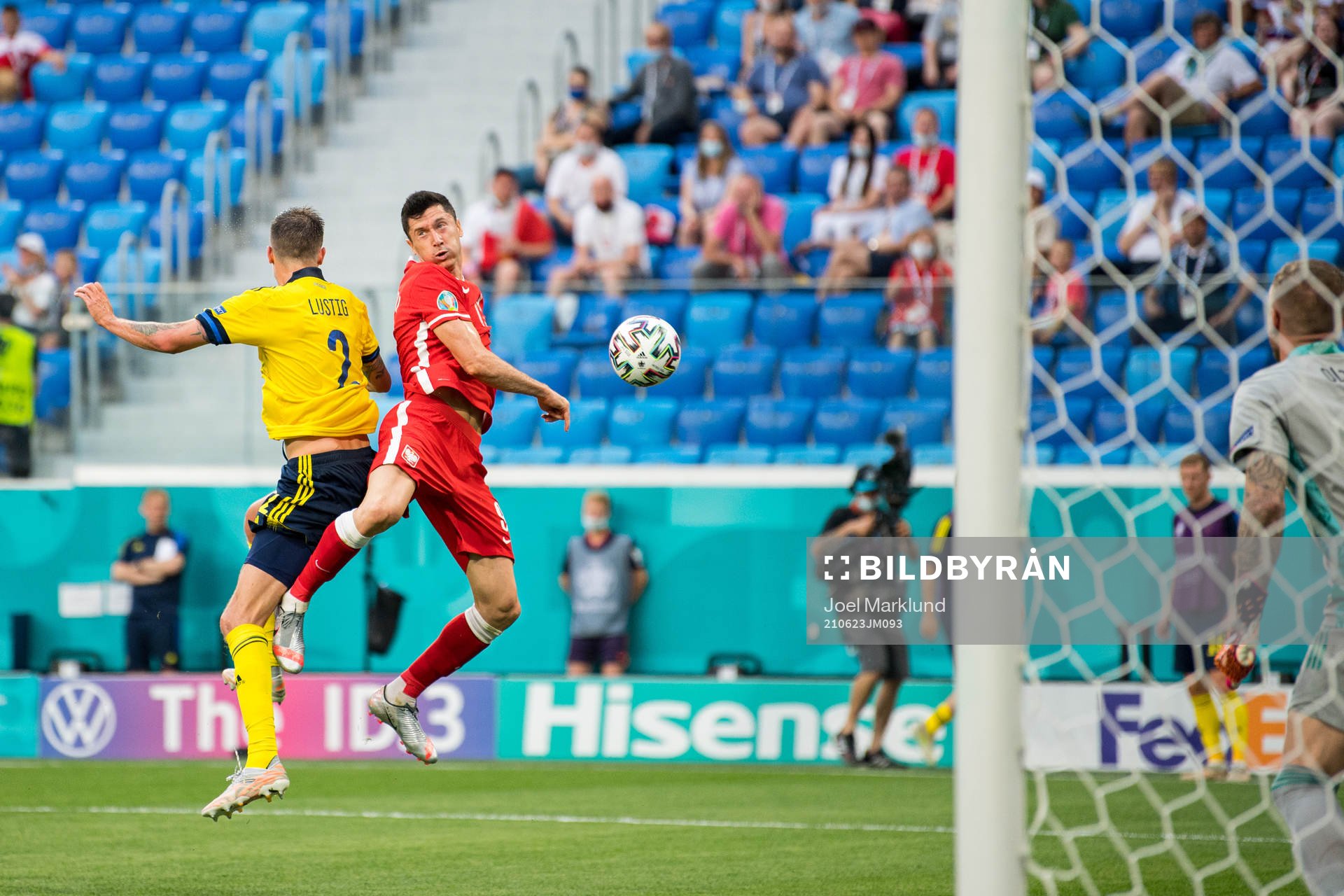 Mikael Lustig of Sweden and Robert Lewandowski of Poland