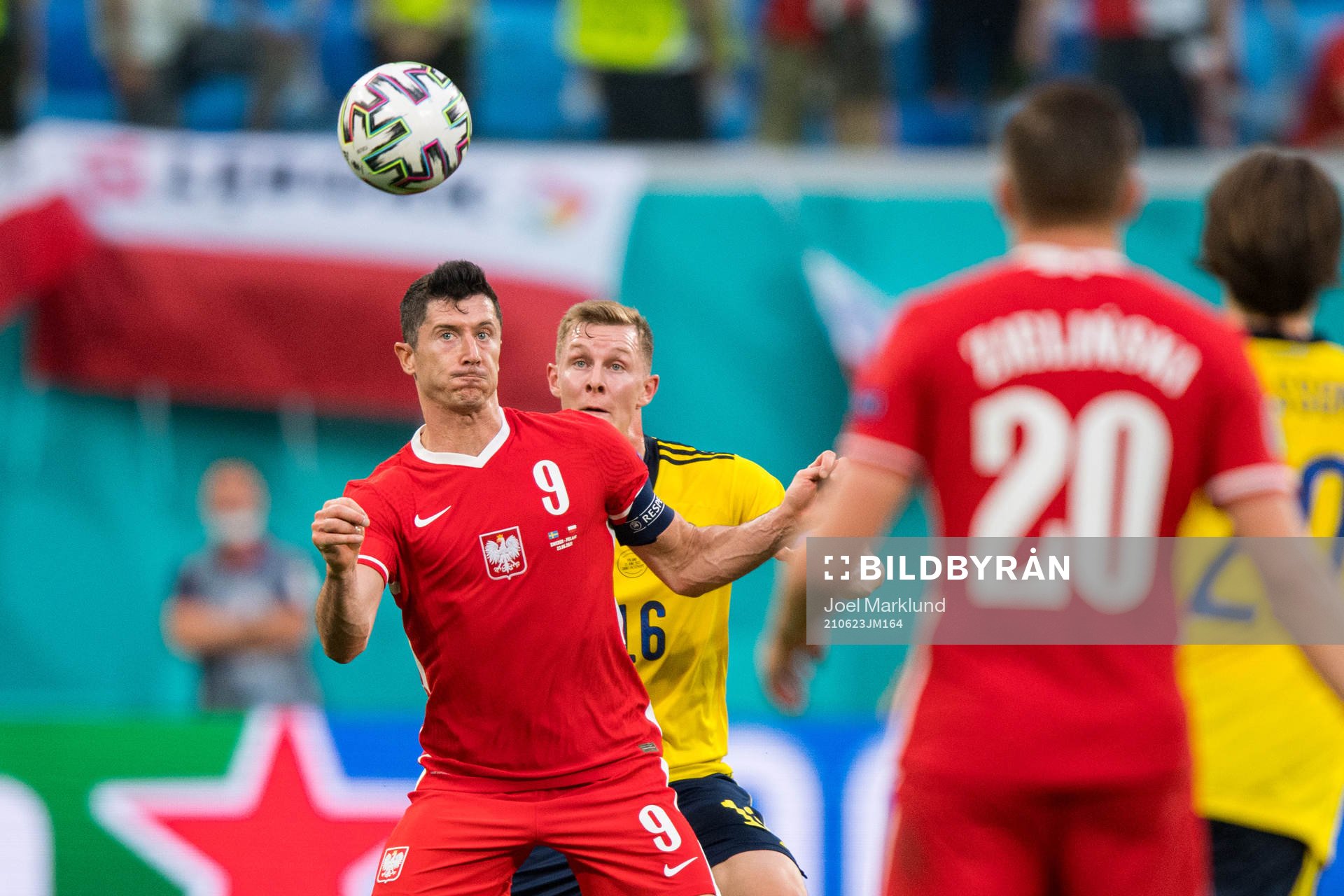 Robert Lewandowski of Poland and Emil Krafth of Sweden