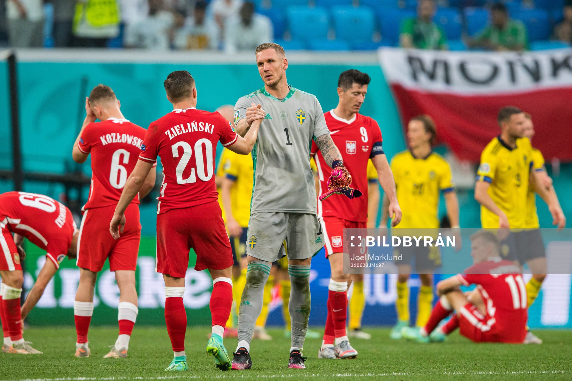 Piotr Zielinski of Poland and goalkeeper Robin Olsen of