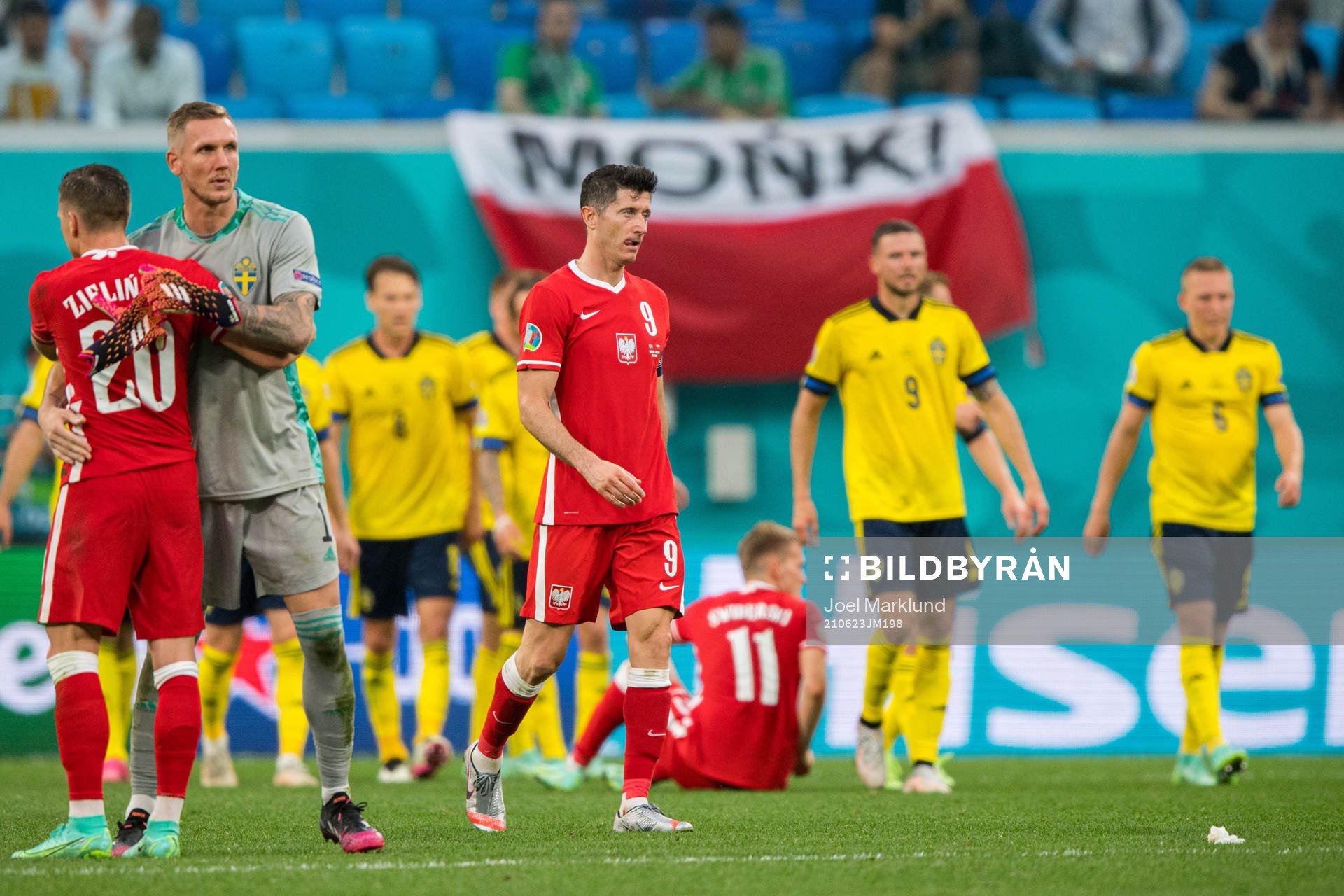 Robert Lewandowski of Poland looks dejected