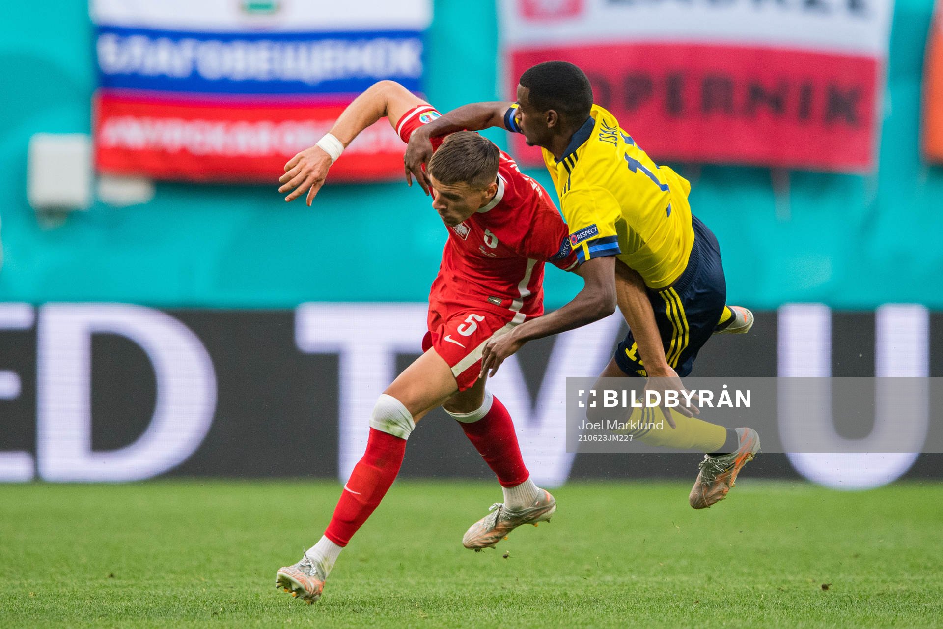 Jan Bednarek of Poland and Alexander Isak of Sweden