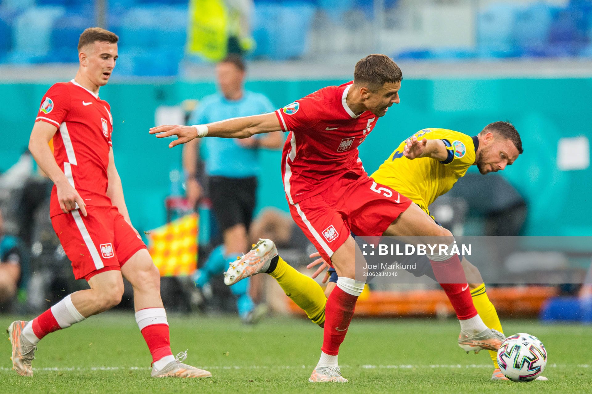 Jan Bednarek of Poland and Marcus Berg of Sweden