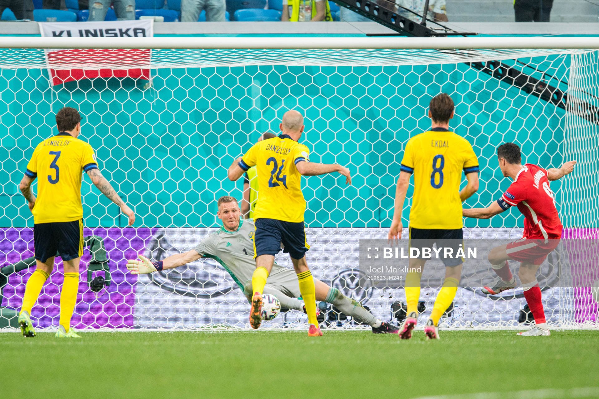 Robert Lewandowski of Poland scores 2-2 against. goalkeeper