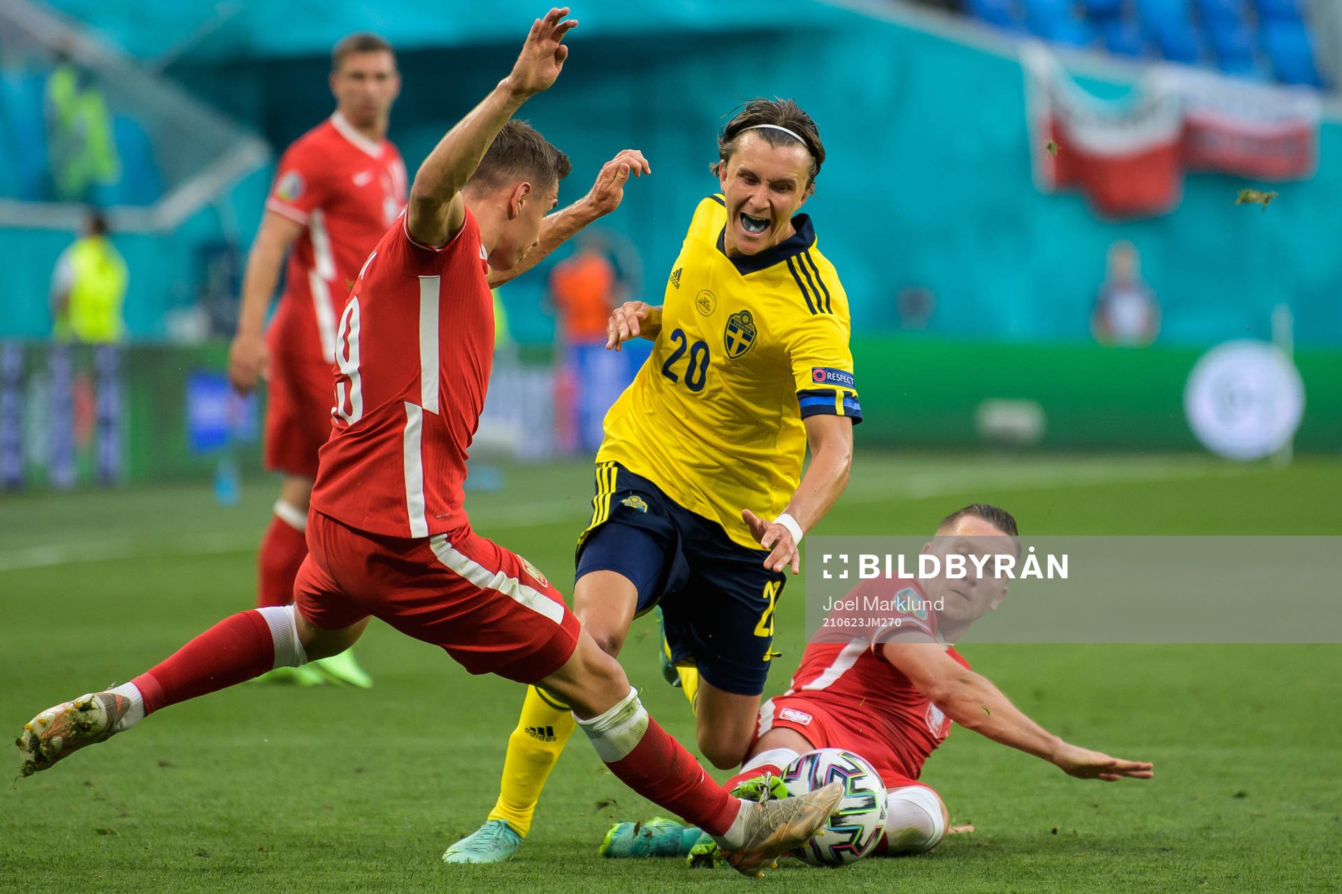 Przemyslaw Frankowski and Piotr Zielinski of Poland in action against Kristoffer Olsson of Sweden during the UEFA Euro 2020 Football Championship match between Sweden and Poland on June 23, 2021 in Saint Petersburg.