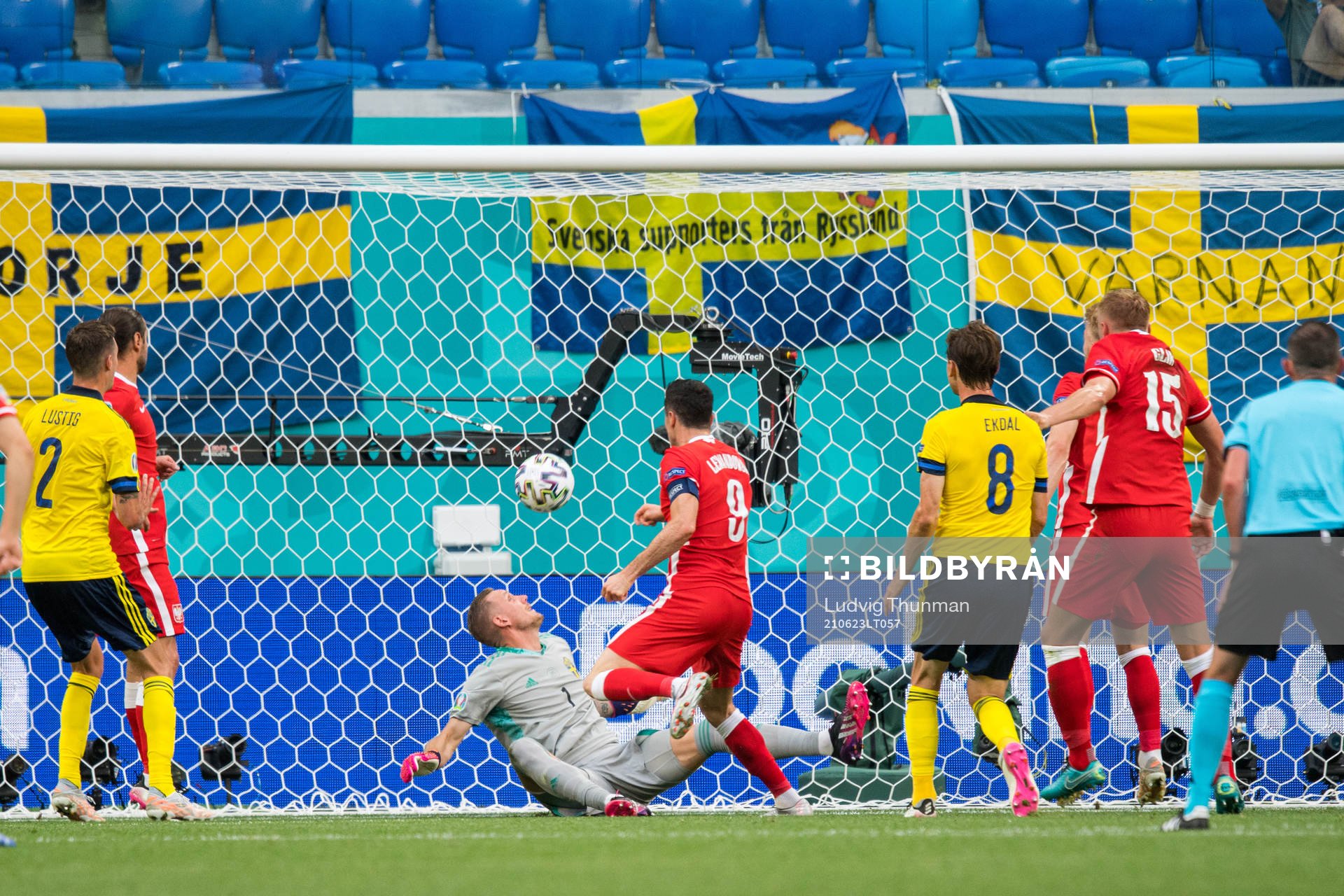 Robert Lewandowski of Poland against goalkeeper Robin Olsen