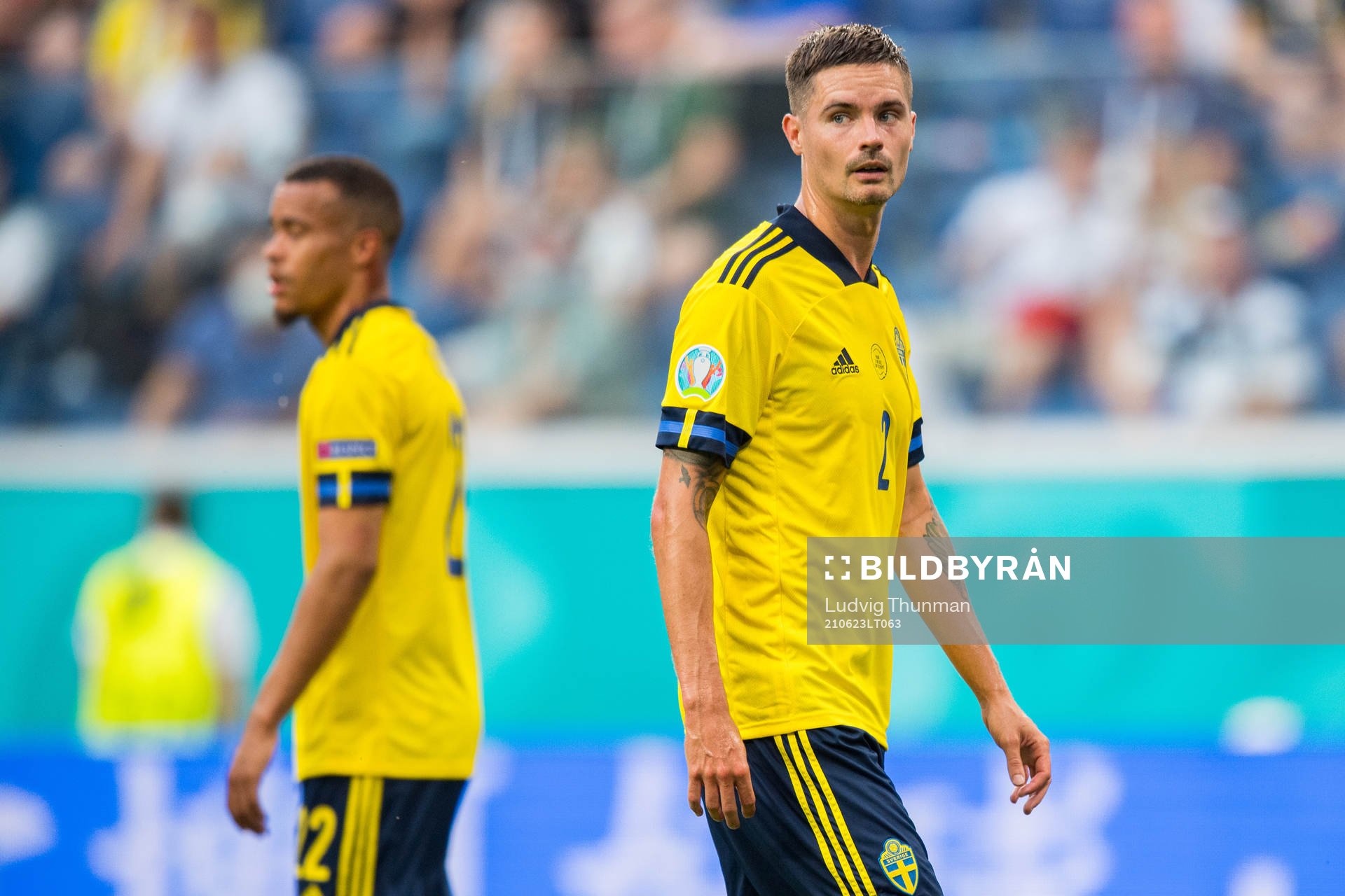 Mikael Lustig and Robin Quaison of Sweden