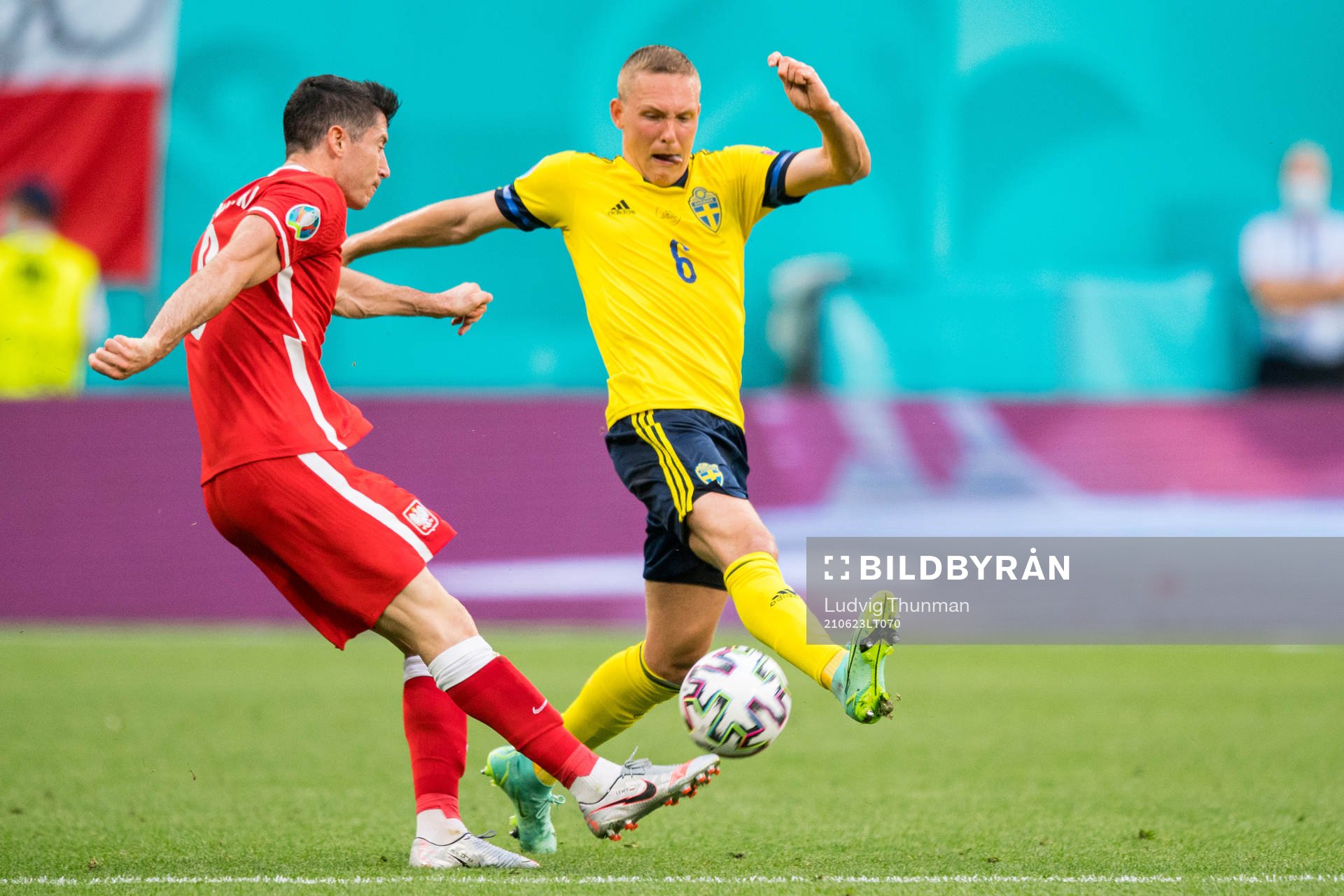 Robert Lewandowski of Poland and Ludwig Augustinsson of