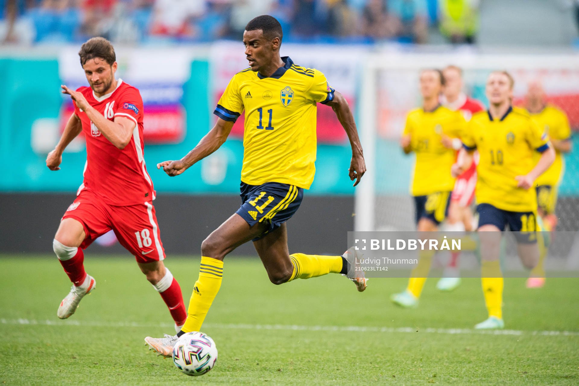 of Poland Bartosz Bereszynski and Alexander Isak of Sweden