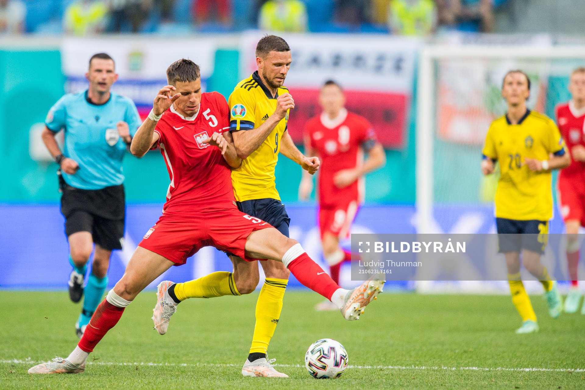 Jan Bednarek of Poland and Marcus Berg of Sweden